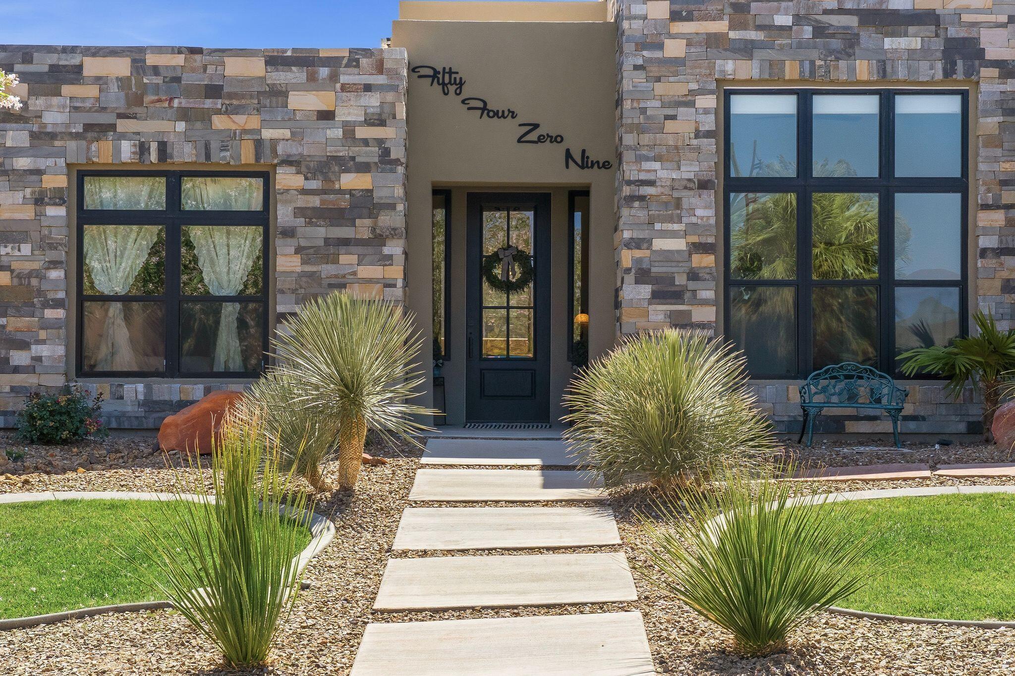 Welcome to this exceptional custom home by BKMA Design & Construction in the Dunes at Sand Hollow Resort. This beautifully designed single-level home features 4 bedrooms, 2.5 bathrooms, and a spacious 3-car garage with epoxy floors, custom cabinets, and a split air/heat unit.

Inside, enjoy the large open-concept layout that offers ample space for entertaining, luxury vinyl wood flooring, quartz countertops, custom finishes, and a gourmet kitchen. The private primary suite opens directly to the covered patio, while the two front bedroom features mountain views and plenty of natural light

Enjoy outdoor living year-round on the covered concrete patio with built-in lighting, ceiling fan, multiple electrical outlets, mature landscaping, and an irrigation system. Additional highlights include HVAC, Rooftop deck with amazing 360-degree views, Zion Mountain views, and golf course red rock views. Ideally located only minutes from Sand Hollow Resort & Quail Lake Reservoir for waterskiing, paddleboarding, and overall fun, plus a short ride to amazing ATV trails.

The HOA provides front and back private yard care and common area maintenance.  Access to discount championship golf, sand dunes, hiking, shopping, and more. Residents also enjoy three resort pools, a hot tub, a fitness center, a driving range, golf discounts, and a full-service clubhouse restaurant with spectacular views.

Experience luxury living and outdoor adventure in one of Southern Utah's premier resort communities.
Put this on your favorite list to come see.








Single level with red rock and mountain views. Cozy and elegant - this home is perfect in so many ways. It is clean desert living in the highly sought-after Sand Hollow Resort - Dunes. This beautifucustomized home blends warmth, comfort, and luxury with an inviting open-concept design, thoughtfully upgraded interiors, and expansive windows that flood the space with natural light.