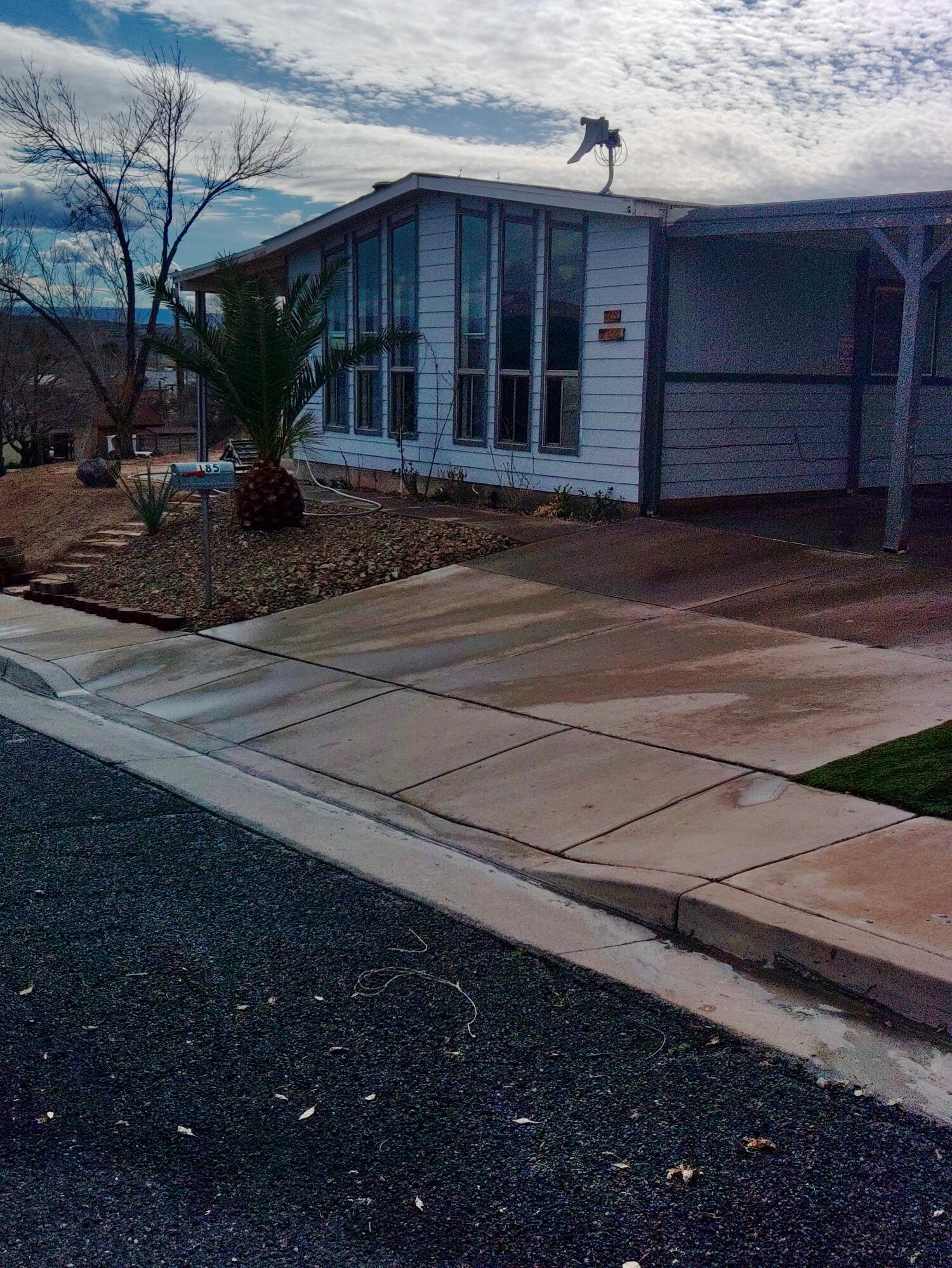 Enjoy breathtaking views of the St. George Temple and stunning Southern Utah red mountains from this beautifully maintained 3-bedroom, 2-bath home situated on a desirable corner lot.

This property offers the perfect blend of comfort, functionality, and lifestyle. The newly renovated kitchen features modern finishes, updated cabinetry, and ample counter space--ideal for everyday living and entertaining.

Step outside and you'll find a backyard designed to enjoy Utah's natural beauty. Relax under the charming gazebo while taking in the mountain views, cultivate your own produce in the dedicated garden area, or enjoy year-round comfort in the detached shop complete with A/C and power--perfect for projects, hobbies, or additional workspace.

The home also includes RV parking and a powered workshop, offering exceptional flexibility for outdoor enthusiasts and hobbyists alike.

With its rare temple views, red rock backdrop, corner lot location, and upgraded features throughout, this home truly captures the best of St. George living.