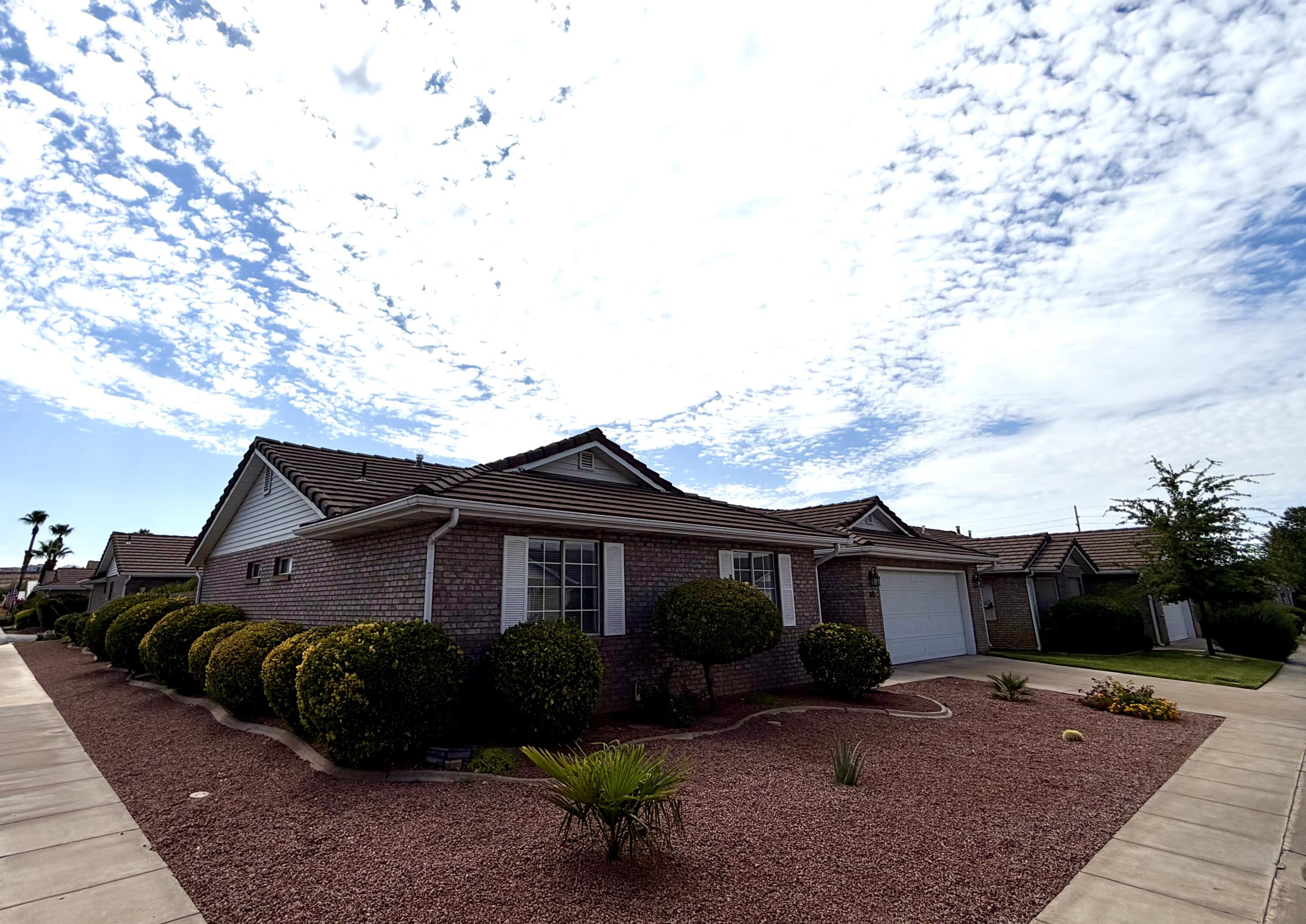 Welcome to Sun Country Meadows South, one of St. George's most sought-after 55+ communities! This beautifully maintained, single-level home offers easy, stair-free living with 3 spacious bedrooms, 2 bathrooms, and a 2-car garage. Built in 1992 with timeless brick construction and a durable tile roof, this home features a comfortable, functional floor plan designed for everyday living. 

Residents enjoy an outstanding selection of community amenities, including a welcoming clubhouse, indoor swimming pool and hot tub, fitness center, billiards room, library, kitchen, dining and dance hall, gathering spaces for family and friends, and a peaceful pond where you can enjoy the ducks and beautiful surroundings. The HOA is $240 per month and covers water, sewer, garbage, private roads, partial yard maintenance, common area care, and full use of all community amenities. Conveniently located just minutes from the hospital, shopping, restaurants, and everyday services, this is the perfect place to enjoy an active, low-maintenance lifestyle in the heart of St. George.