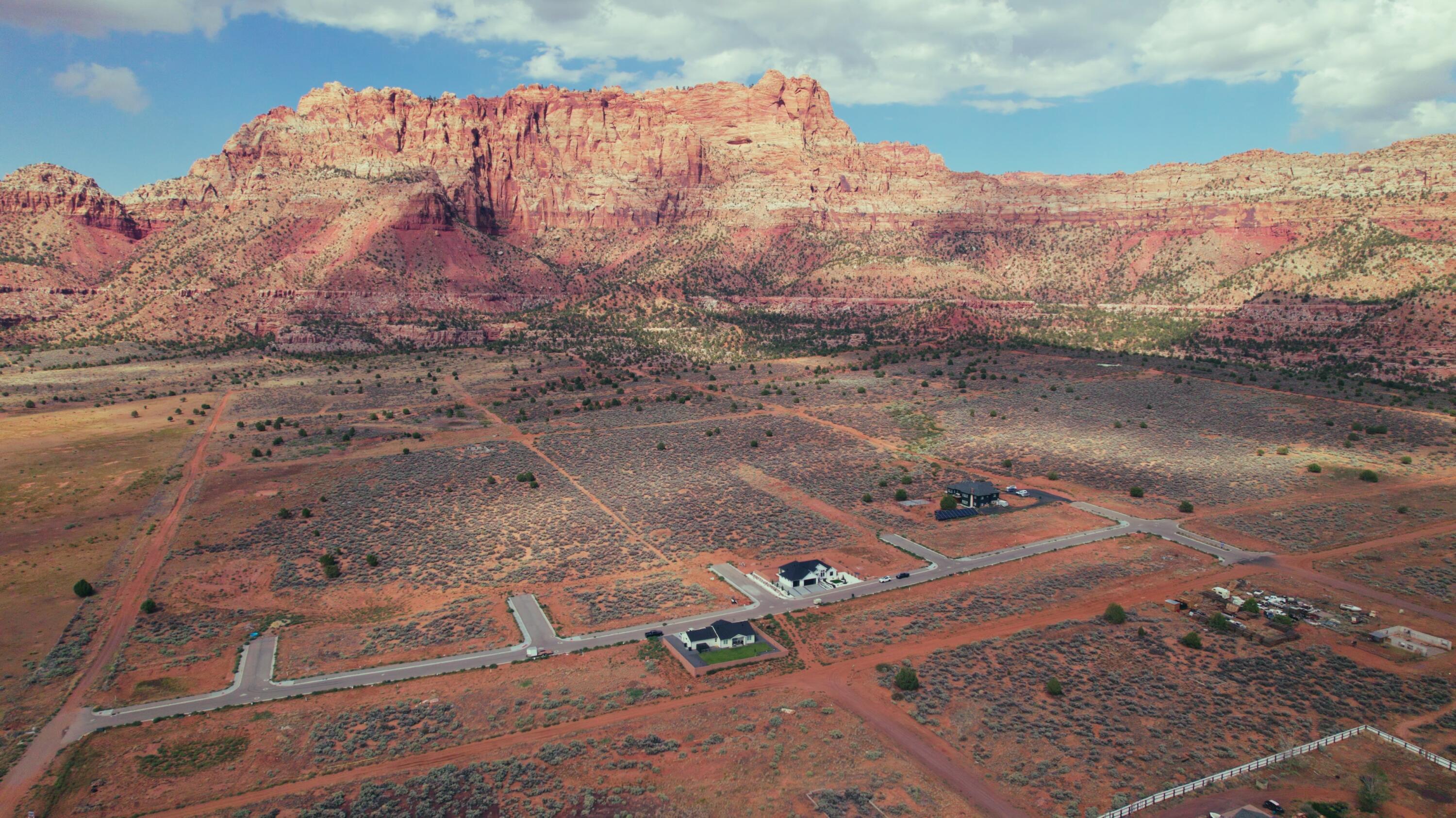 Stop scrolling. This is the one. For 150,000 you lock in the land and for under 500,000 to 600,000 all in you are moving into a brand new home with a view that does not exist anywhere else in Washington County. Period.

The Heights is not just lots. It is life on the edge of Zion National Park. Every morning the cliffs light up like a painting and every evening the desert sky puts on a private show. Step outside and the adventure is endless with BLM trails, slot canyons, Coral Pink Sand Dunes, Bryce Canyon, the Grand Canyon and Lake Powell all within reach. This community comes stacked with walking paths, pickleball courts, parks and room to breathe because your backyard deserves to be just as epic as the view.

This is more than dirt. It is a once in a lifetime chance to build the Southern Utah lifestyle you have always wanted and to do it under 600K. No gimmicks. No compromises. Just views, value and the adventure of a lifetime.