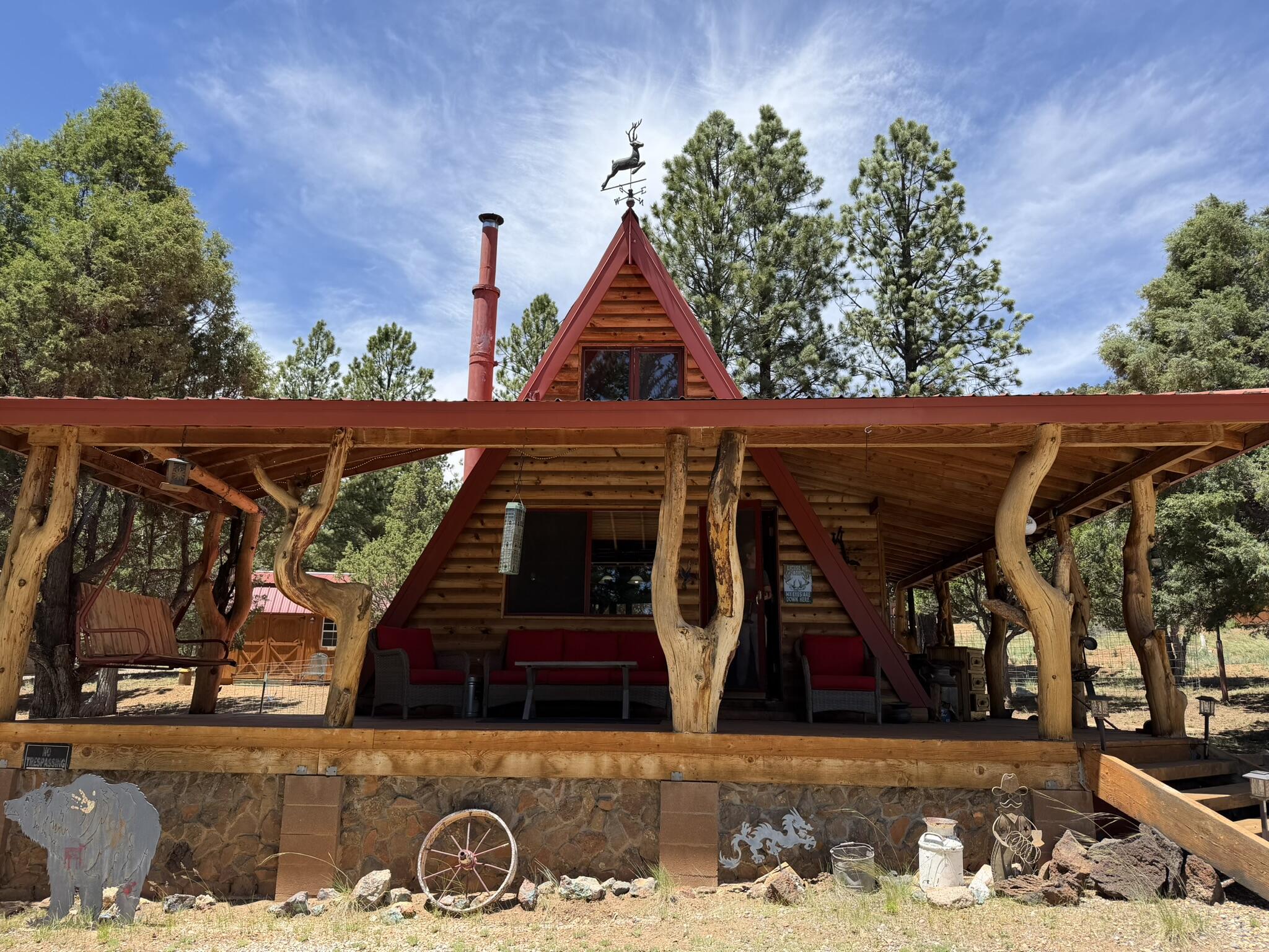 Unique, fully furnished ''Treehouse'' Cabin in Mammoth Creek, located directly off the paved and plowed road.  Recently remodeled with a new Kitchen, Living area and Staircase. Accessible all year!  Includes a covered Wrap around Deck.  There is also a Bunkhouse added in 2022 adjacent to the Cabin that has full Power!  The main bedroom in cabin is the Loft upstairs.  Tommy Creek, and Mammoth Creek runs year around, and is a short distance away.  Small enclosed shed for tools, toys etc.  New Electric panel in 2022.  New plumbing in 2025.