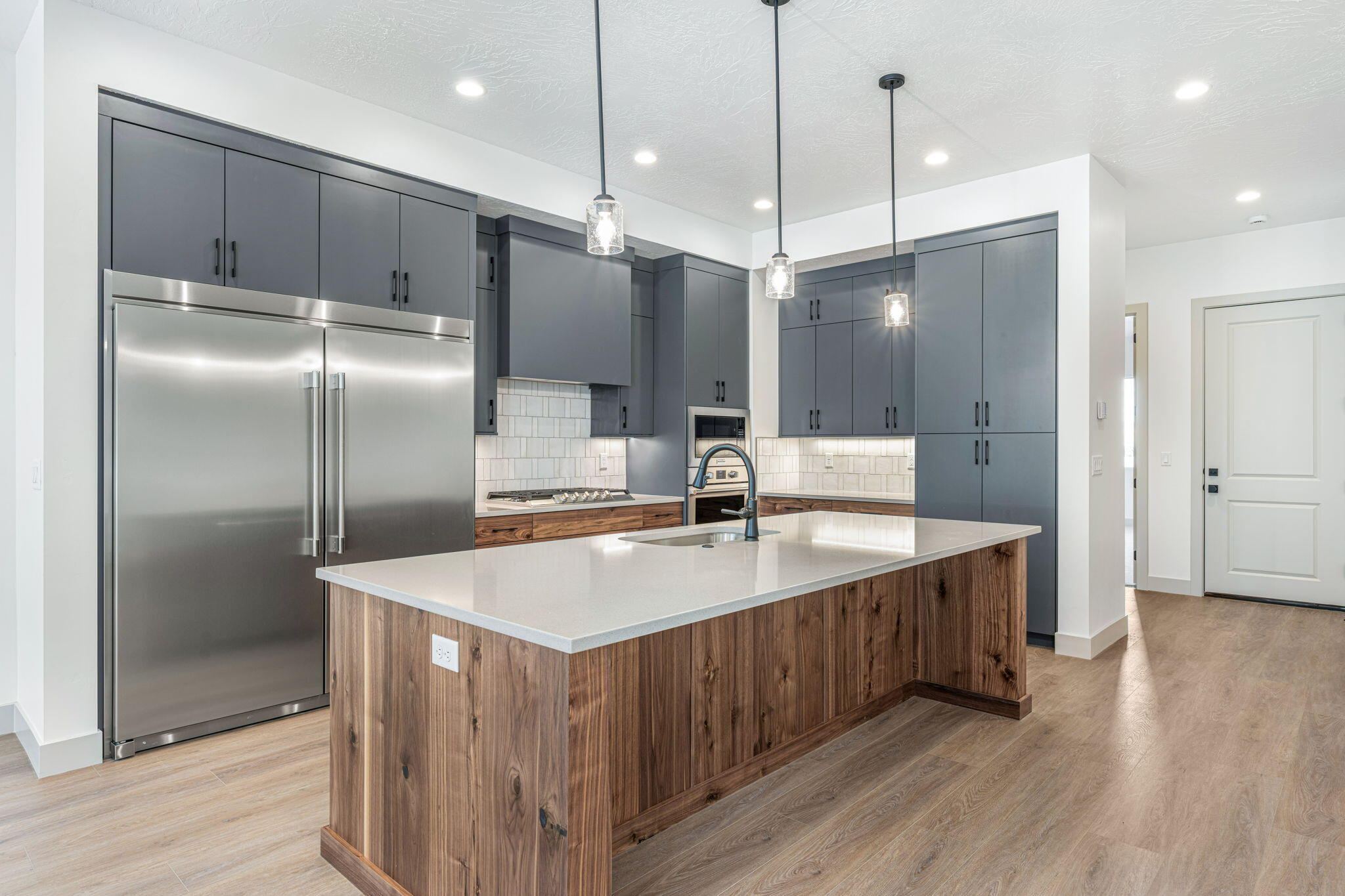 Located in the vibrant Desert Color community, the Monterey offers 3,400 square feet of contemporary living. With 6 bedrooms and 6 bathrooms, this townhome features a gourmet kitchen, built-in banquette, and mini bar, making it ideal for hosting family or friends. Bunk rooms create extra space for large groups, while the second-floor deck, complete with a hot tub and fire table, invites relaxation in this premier vacation destination.