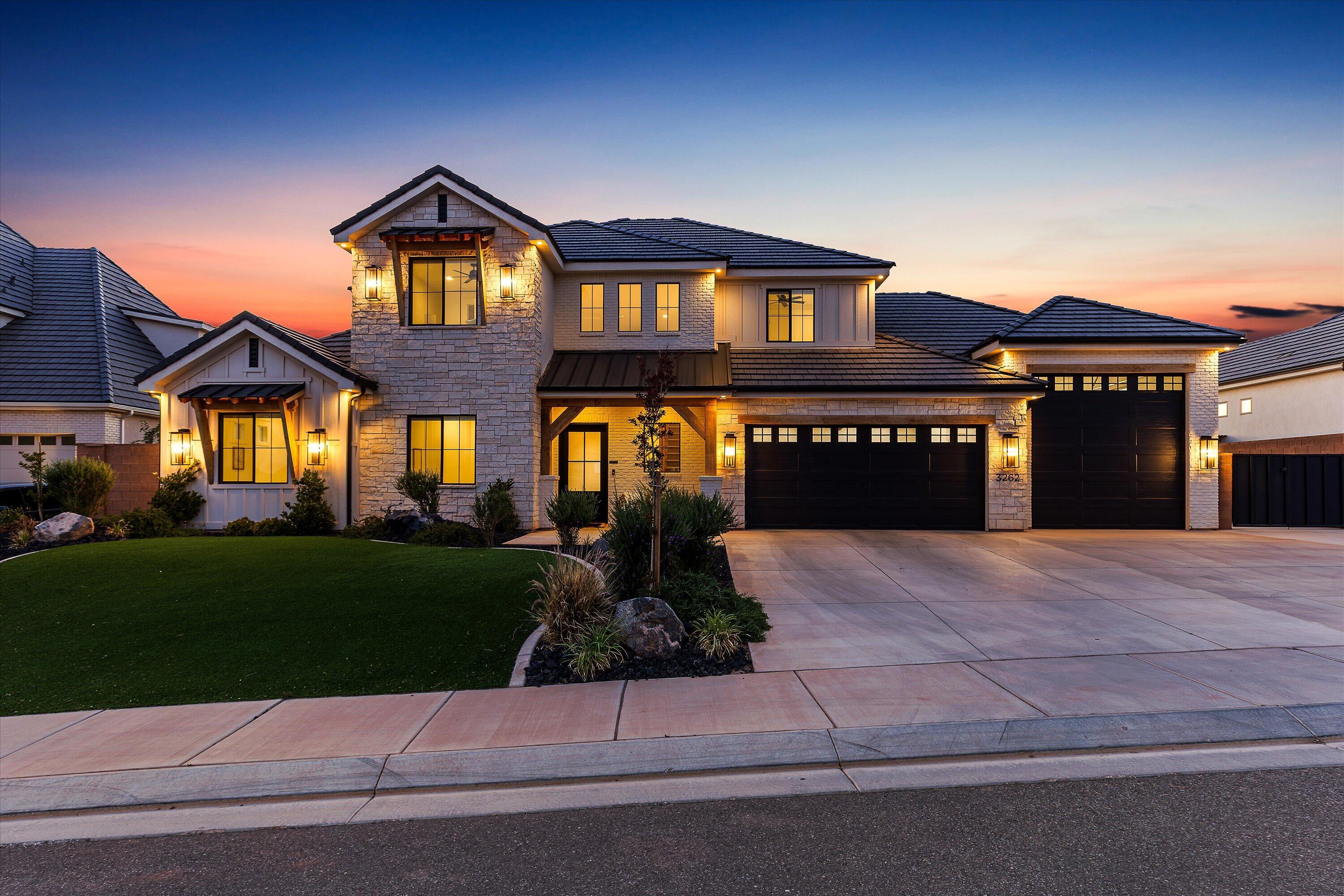 The Little Valley Oasis. Perched high above the city w/ breathtaking mountain and valley views, this 2023 luxury estate is the ultimate Southern Utah retreat. Featuring 3,690 sqft, 5 bed, 4.5 bath, office, upstairs family room w/ kitchenette, and attached 1,158 sqft RV Garage w/ 12' Door + 2-car garage. Open-concept design w/ natural light, gas fireplace, quartz countertops, ceiling-height soft-close custom cabinetry, Frigidaire Professional appliances, oversized walk-in pantry, tankless water heater, water softener, EV charger. Main-level suite offers spa-style bath w/ soaker tub, walk-in shower, dual vanities, and large closet. Resort oasis backyard includes pool/spa with waterfall/fire feature, lit pickleball court, trampoline, covered patio, turf, fruit trees, and fully fenced. No HOA.