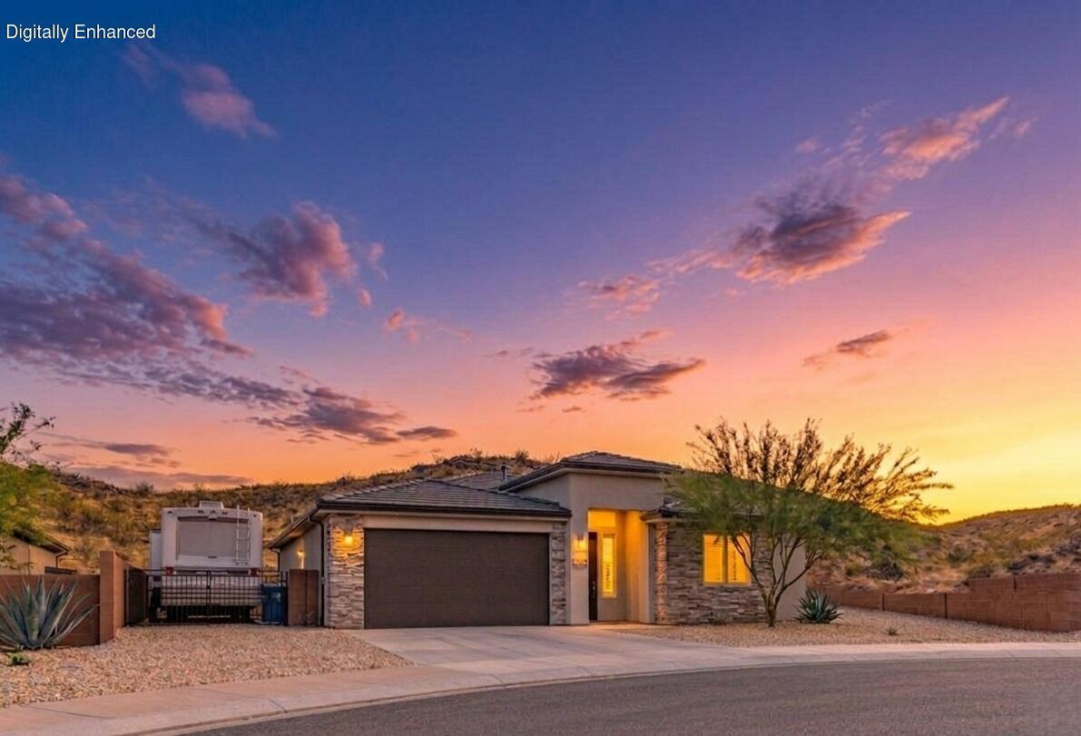 This meticulously upgraded retreat has been completely dialed in for privacy, entertaining, and functional luxury. The bright, vaulted living space immediately stands out with 9 to 10-foot ceilings, premium Hunter Douglas blinds, upgraded carpet with plush memory padding, and a thoughtful floor plug seamlessly positioned for your great room couch. The kitchen is built for those who love to entertain, featuring durable quartz countertops, a beautiful backsplash, an in-wall oven and microwave, and a gas cooktop finished with a stylish cabinet hood. The owner's retreat delivers a relaxing setup with double sinks and a beautifully tiled, oversized shower with glass doors.

Outside, the property offers a quiet retreat from day one, featuring a private backyard, a large side yard, and fully completed landscaping enclosed by block privacy walls. The east-facing covered patio is completely ready for your dream setup with a 220V outlet for a hot tub or swim spa, plus a convenient gas BBQ hookup.

What truly sets this home apart is the brilliant electrical planning. You have 15 feet of dedicated RV parking with full hookups including 220V, water, and a sewer dump. The garage includes its own 220V outlet for an electric vehicle or air compressor, and the exterior eaves feature a dedicated lighting outlet hooked to an interior switch for effortless holiday decorating. Schedule a showing today to see these premium features in person.