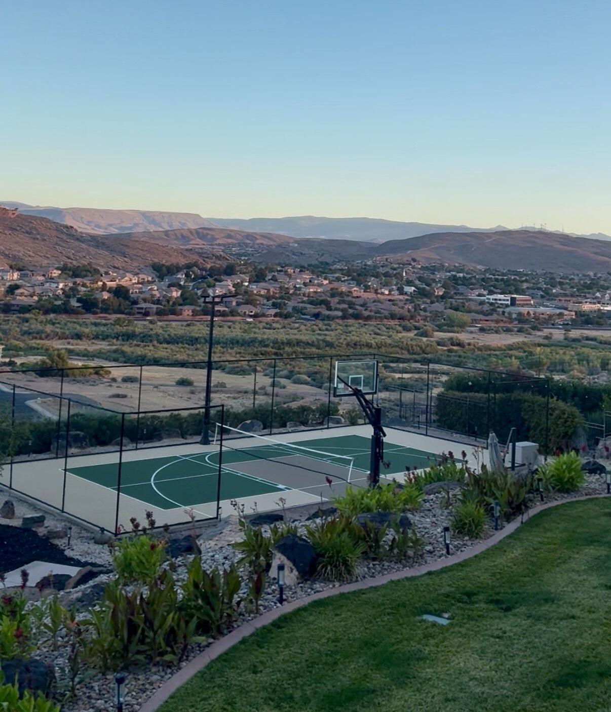 Perched on Foremaster Ridge, this .69-acre lot, the park-like backyard is a true retreat, complete with a professional grade, private, pickleball court, mature landscaping, RV parking, and plenty of room to enjoy being outside. Take in the sweeping city and mountain views from the oversized deck or beneath the covered patio. This custom 5-bedroom home showcases breathtaking panoramic views out the windows and an exceptional blend of space, comfort, and functionality. The floor plan features two full kitchens, two spacious living areas, plus a separate family room. Located just minutes from shopping, dining, medical facilities, parks, and more.