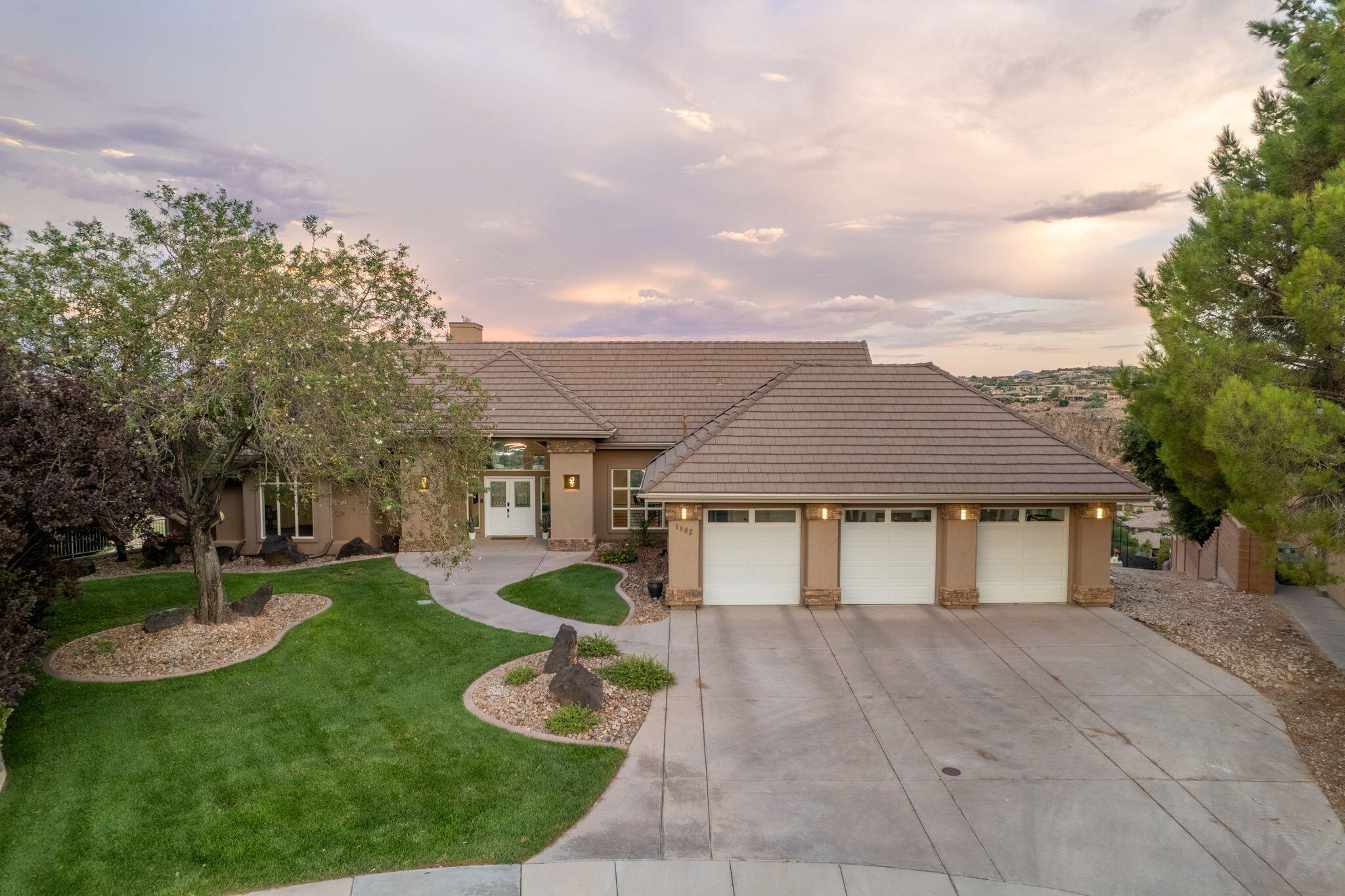 Perched on Foremaster Ridge, this .69-acre lot, the park-like backyard is a true retreat, complete with a professional grade, private, pickleball court, mature landscaping, RV parking, and plenty of room to enjoy being outside. Take in the sweeping city and mountain views from the oversized deck or beneath the covered patio. This custom 5-bedroom home showcases breathtaking panoramic views out the windows and an exceptional blend of space, comfort, and functionality. The floor plan features two full kitchens, two spacious living areas, plus a separate family room. Located just minutes from shopping, dining, medical facilities, parks, and more.
