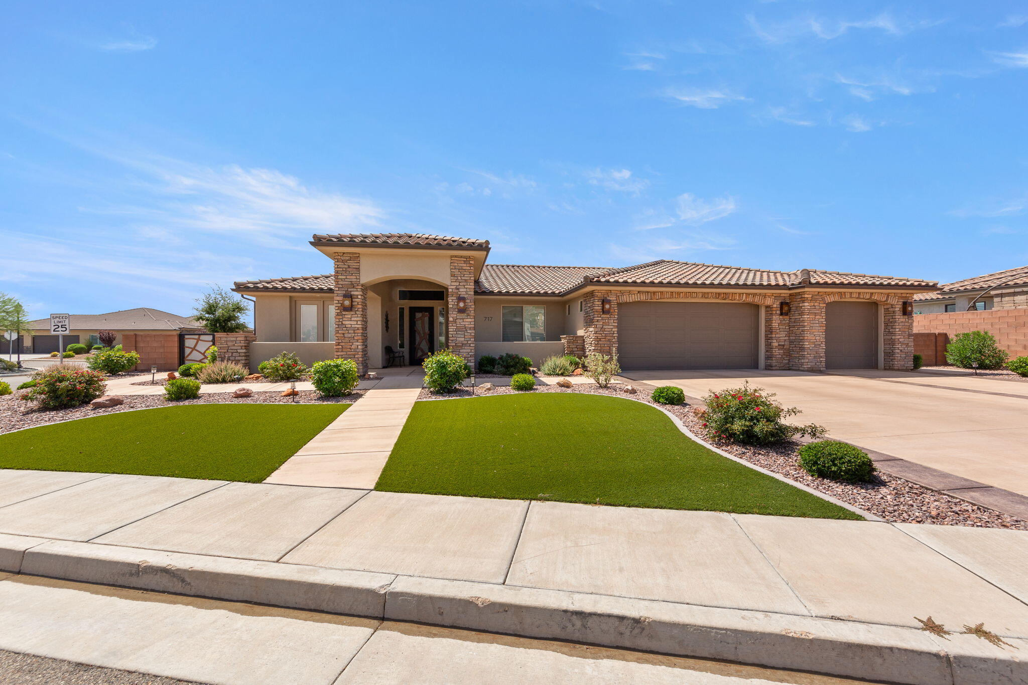 Desirable Green Springs Delight! This custom-built Bangerter home is loaded with upgrades from the designer front door to the last detail, opening into stunning open-concept layout anchored by a showstopper chef's kitchen with walnut cabinets, designer faucets, an oversized granite island with seating for 4+, a walk-in pantry, and stainless-steel appliances built for both daily living and entertaining. A 2,525 sq. ft., the well-designed floorplan offers 4 bedrooms, an optional office, and 3.5 baths, plus a private casita with its own entrance, full bath, bedroom, and kitchenette...ideal  for guests. The luxurious master retreat includes a walk-in closet, dual sinks, a designer shower, and a separate jetted tub, while the expansive great room with fireplace opens to a xeriscaped backyard with an oversized covered patio and gas BBQ, perfect for entertaining or quiet evenings under breathtaking views of Pine Valley Mountain and the Red Rocks. Rounding out the home are premium tile flooring and an extra-large 927 sq.ft. 3 car-garage (extra wide, extra deep, with shelving) and so much more, all just minutes from Green Springs Golf Course, shopping, the freeway and restaurants.