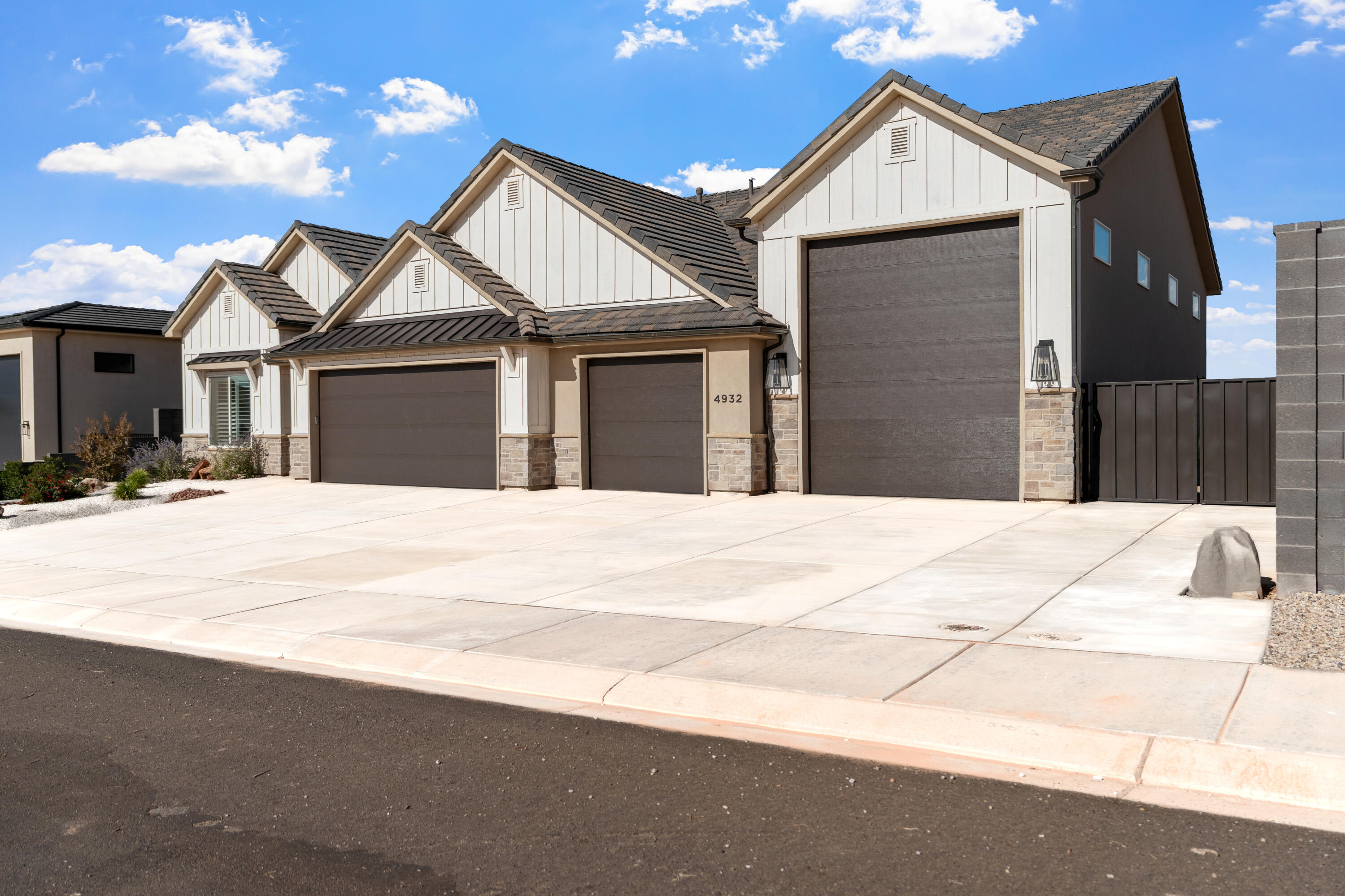 Beautifully maintained home in Oak Haven with stunning Pine Valley and Silver Reef views. Features a 3-car garage plus RV garage with nearly 1,700 sq ft of total garage space, perfect for desert and lake toys. RV garage dimensions are 18' wide and 50' deep. Open floor plan includes a spacious living area, upgraded kitchen, dining space, and a cozy fireplace. The primary suite offers a soaking tub and walk-in shower. Additional bedrooms provide office or gym options. Upgrades include LVP flooring, blackout shades, custom gates, expanded patio, added concrete, EV hookups, and epoxied floors. Ideal location near Sand Hollow and Quail Creek Reservoirs with quick UTV trail access. Move-in ready and feels like new!
