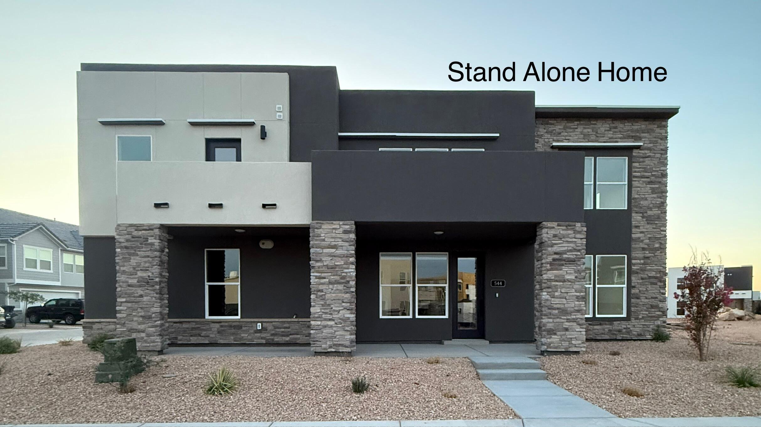 MOVE IN READY - MOVE IN TODAY - THIS IS A STAND ALONE HOME '' VERONA FLOOR PLAN '' - NOT CONNECTED TO ANOTHER HOME LIKE SOME - THIS IS THE LEAST EXPENSIVE STAND ALONE HOME IN DESERT COLOR - Features 23-foot vaulted ceilings and a balcony off the master. Located in Desert Color. Come by the home today for 24/7 access for showings. Phone number is listed on the door. Open house every day from 10am to 8pm. Desert Color Amenities: A lagoon for paddle boarding, kayaking, or long distance swimming. Resort style, year-round heated pool and hot tub. Another pool and hot tub. Paved bike / golf cart trails. Apx. 2 miles or less from Smiths grocery store, Starbucks coffee shop, Peach Wave, Swig, credit unions, a med spa, Del Taco, Costco, a nail salon, Pizza Hut, Chipotle, Jersey Mike's, golf, and 'In and Out' is coming. Walking distance to Arizona State land for hiking, dirt bikes, and atv's. This home has been lightly lived in since May 2025. The loft has the ability to be turned into a 3rd bedroom easily and currently has a queen bed. The garage is a two stall garage but it is a deep garage that 4 small cars can fit. So much natural light! Perks: Hot water on demand, water softener, epoxy garage floor, counter depth fridge, and option to purchase it furnished with a golf cart.