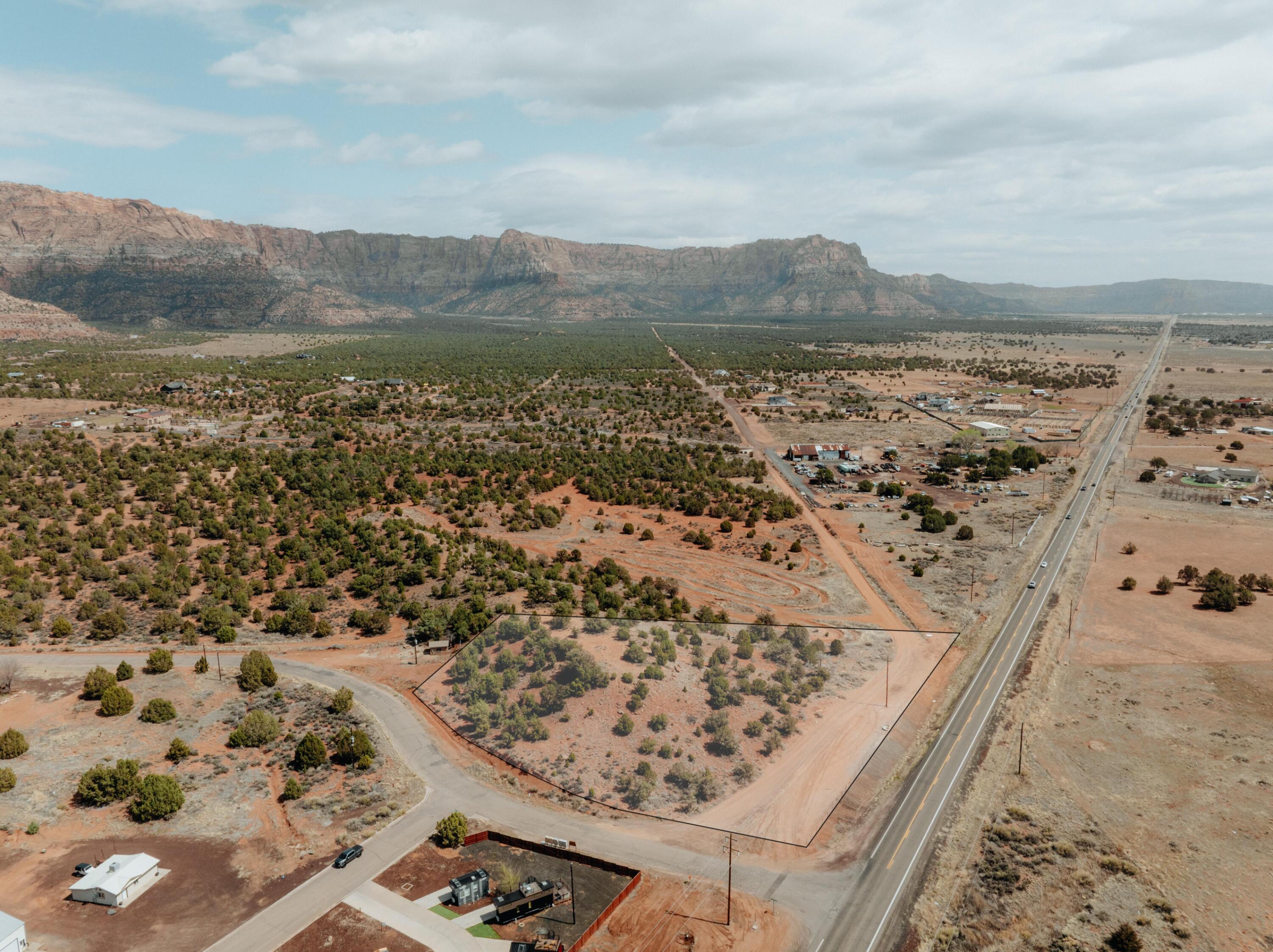 Tucked next to BLM land, this one-of-a-kind 2.33-acre view lot offers a unique opportunity to own your own hill with unobstructed views that stretch for miles. Imagine waking up every day to breathtaking scenery and the tranquility of nature right at your doorstep. Currently zoned as open space, this property provides the perfect canvas for your dream home or a serene getaway. With the surrounding BLM land, you'll enjoy privacy and access to outdoor adventures, making it an ideal spot for nature lovers and those seeking a peaceful retreat. Don't miss out on this rare gem!