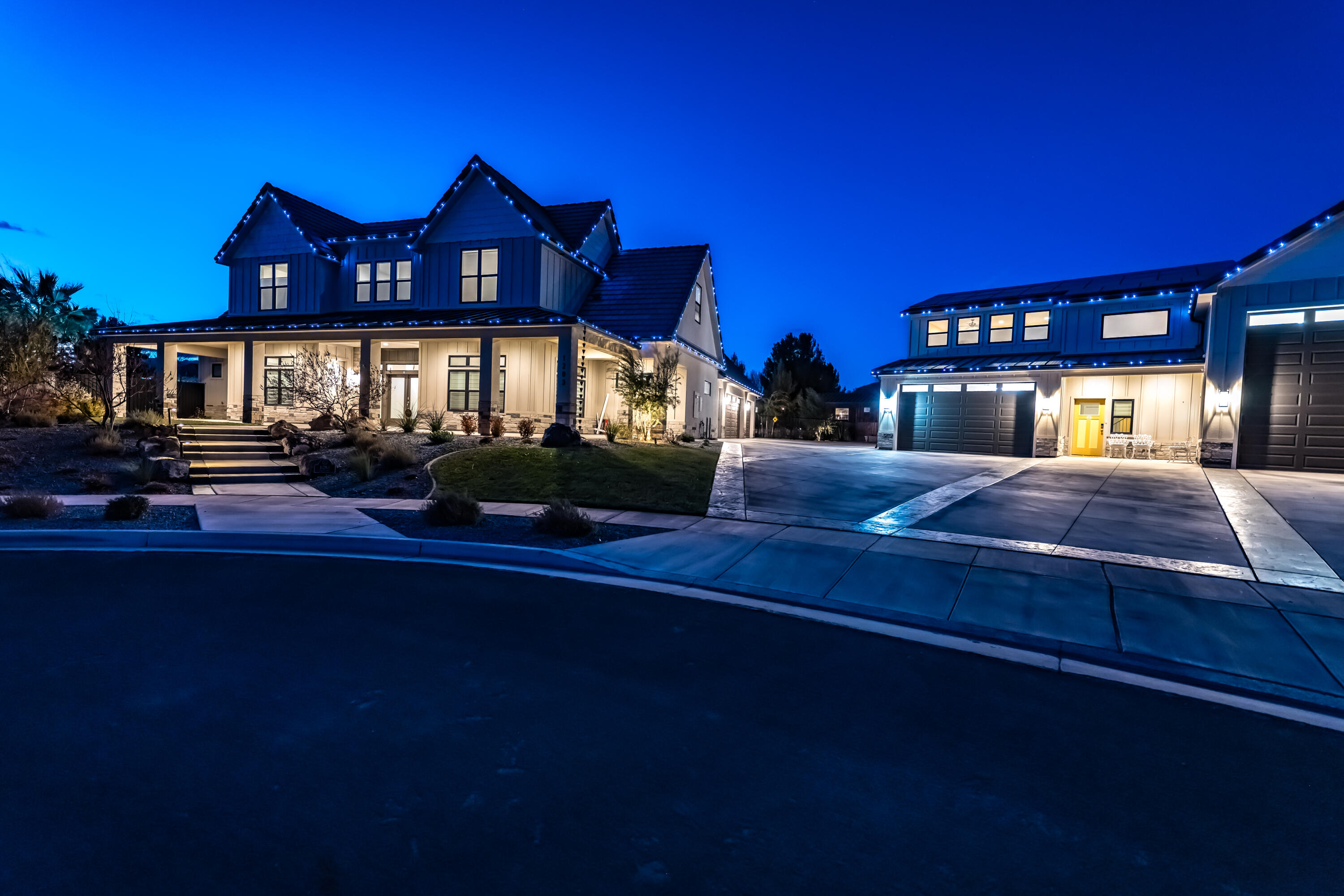 This unique home blends modern luxury & thoughtful functionality on a spacious .51-acre lot.  This meticulously designed home is perfect for those seeking comfort, convenience & outdoor entertainment. The main floor offers primary suite with en-suite bathroom & walk-in closet for your private retreat, spacious office with private entrance ideal for remote working, large gourmet kitchen w/butler's pantry, mudroom, family room & half bathroom.  Upstairs offers 3 bedrooms including 1 bedroom w/ en-suite bathroom, full bathroom & a 2nd family room area. Basement offers a fantastic space for all your storage needs. Note: Separate building adjacent to main home features a furnished 1 bed 1 bath apartment fully furnished. RV bay w/hookups, 2nd bay extra deep w/workbench, storage & 1/2 bath.