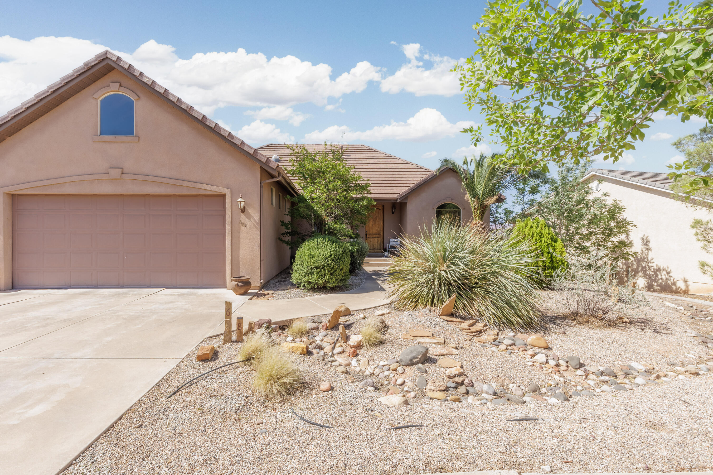 Welcome to Desert Hills, where the views are breathtaking, the pace is peaceful, and the sunsets deserve their own Instagram account. This beautifully maintained 4-bedroom, 3-bath home combines comfort, style, and functionality in one of the area's most desirable communities.

Enjoy stunning views of Pine Valley Mountain and the surrounding valley from an open-concept floor plan designed for both relaxing and entertaining. The private master suite offers the perfect retreat, while the spacious oversized basement provides plenty of room for hosting guests, movie nights, or hiding from your kids for five peaceful minutes.

The backyard is private, inviting, and ready for everything from summer BBQs to quiet evenings under the stars. Inside, upscale upgrades include hardwood flooring, granite countertops, designer light fixtures, oversized windows, and thoughtful finishes throughout.

Need storage? This home came prepared. Along with generous basement storage, you'll find an impressive 540 sq. ft. attic storage room above the garage -- perfect for holiday décor, outdoor gear, or the Costco haul you promised wouldn't happen again.

Luxury living, incredible views, and room for everyone -- this Desert Hills home checks all the boxes.