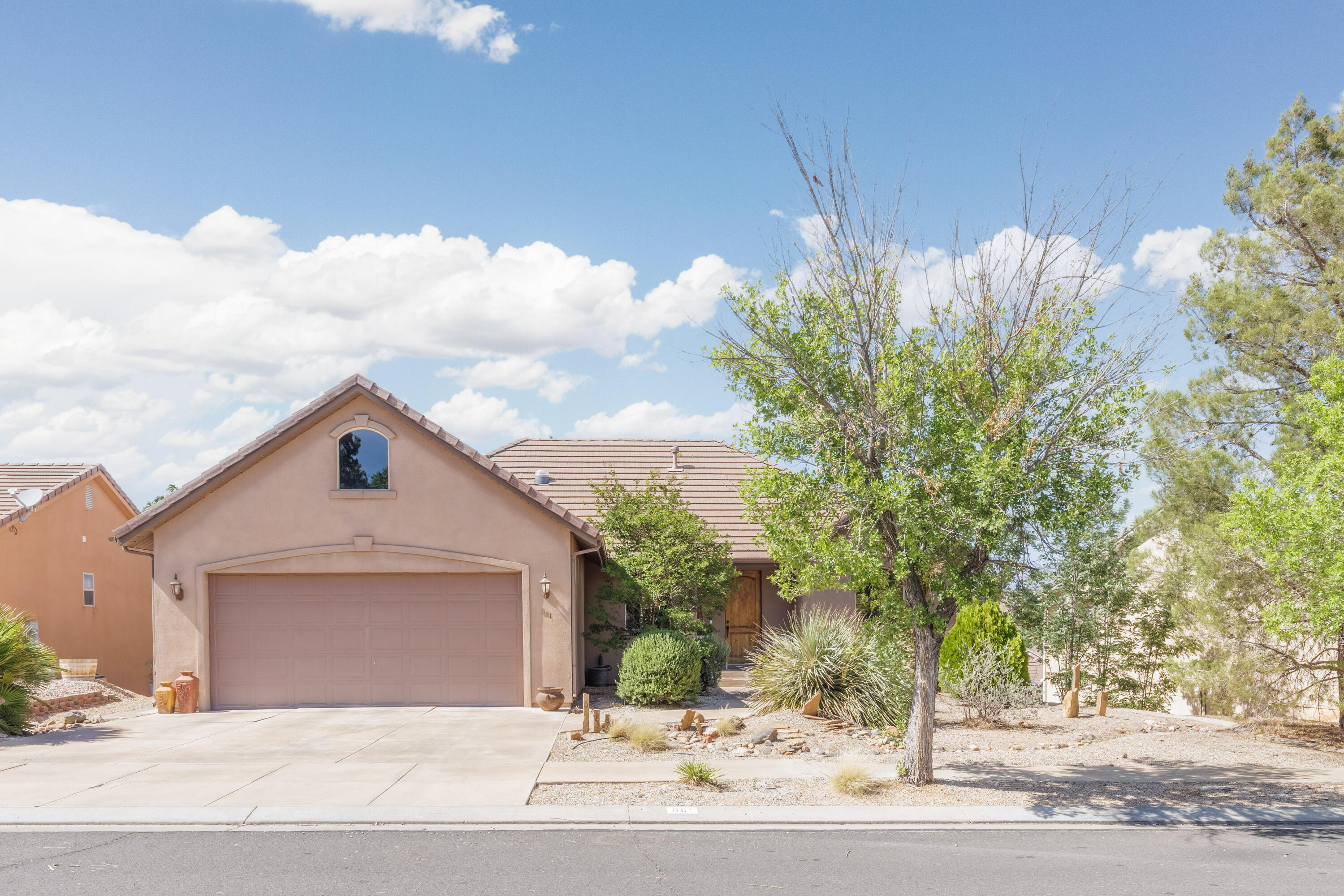 Welcome to Desert Hills, where the views are breathtaking, the pace is peaceful, and the sunsets deserve their own Instagram account. This beautifully maintained 4-bedroom, 3-bath home combines comfort, style, and functionality in one of the area's most desirable communities.

Enjoy stunning views of Pine Valley Mountain and the surrounding valley from an open-concept floor plan designed for both relaxing and entertaining. The private master suite offers the perfect retreat, while the spacious oversized basement provides plenty of room for hosting guests, movie nights, or hiding from your kids for five peaceful minutes.

The backyard is private, inviting, and ready for everything from summer BBQs to quiet evenings under the stars. Inside, upscale upgrades include hardwood flooring, granite countertops, designer light fixtures, oversized windows, and thoughtful finishes throughout.

Need storage? This home came prepared. Along with generous basement storage, you'll find an impressive 540 sq. ft. attic storage room above the garage -- perfect for holiday décor, outdoor gear, or the Costco haul you promised wouldn't happen again.

Luxury living, incredible views, and room for everyone -- this Desert Hills home checks all the boxes.