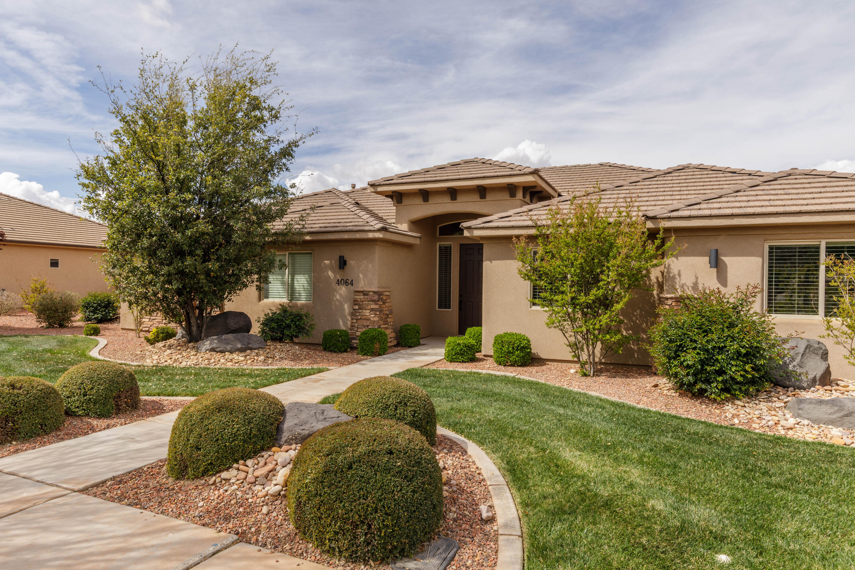 Recently remodeled and updated 4 bed, 2 bath, single level home in the Crimson Cliffs school boundaries. This home features a new expanded kitchen with large island, bar seating, quartz countertops, induction stove and walk-in pantry. New LVP flooring has been installed in the main living areas in addition to new neutral colored paint with white trim. The primary bathroom features a large custom dual head walk-in shower, freestanding soaking tub, double sink vanity and custom closet organizers. The great room is light, bright and open. Perfect for entertaining! The 3 car garage features a mini-split, insulated doors, a 220V outlet and a temporary enclosed clean room area. The secluded, fenced backyard is landscaped to perfection with a grassy area, mature trees & large covered patio. Centrally located and within walking distance to the high school and a large neighborhood park. Don't miss your chance to have a newly updated home in a well established neighborhood.