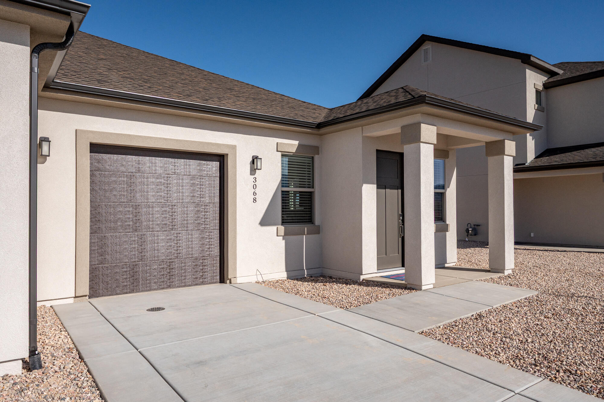 Just completed twin home, new construction offering 993 sq. ft. of efficient, modern living with a thoughtfully designed open floor plan. The kitchen and great room connect seamlessly, creating a bright and functional space for everyday living. Upgraded finishes and contemporary fixtures add a polished, modern feel throughout. The primary suite includes an attached bath, while a second bedroom and full bath provide flexibility for guests, workspace, or hobbies. Fully landscaped yard, covered patio, and attached one-car garage complete the home. A low-maintenance, move-in-ready option with modern design in a growing neighborhood.