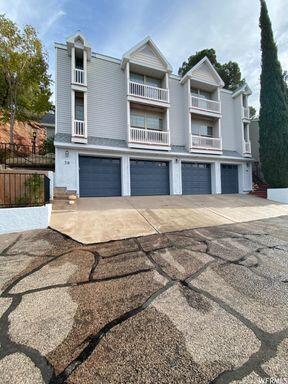 Charming Renovated Townhouse with Valley Views. Discover this beautifully remodeled townhouse offering great updates, stunning valley views, and an unbeatable location. Perfect for investors or homeowners alike, this turnkey property blends style, comfort, and exceptional convenience. Kitchen: Completely remodeled with elegant granite countertops and newer cabinetry. LVP flooring and fresh carpet throughout. Full Appliance Package: Includes stove, microwave, dishwasher, refrigerator, washer, and dryer. Enjoy fantastic views of the valley. Ample Storage: Features a massive, dedicated storage space conveniently located behind the garage.Prime Location: Situated within very close proximity to downtown, Utah Tech University, shopping, dining, and entertainment. This unit is priced at $359,900 and has to be sold in conjunction with Unit 38 (which is also listed at $359,000). Units 32 and 34 are also available for purchase, offering an excellent opportunity to acquire up to four identical, highly desirable units.Unit 36 Status: Currently vacant; new tenants are scheduled to move in on August 1st.Units 32, 34, & 38 Status: Tenant-occupied. All units feature the exact same floor plan and high-end upgrades.Note: Tenant-occupied units are viewable only upon receipt of an accepted offer. Information is deemed reliable but not guaranteed. Buyer to verify all information.