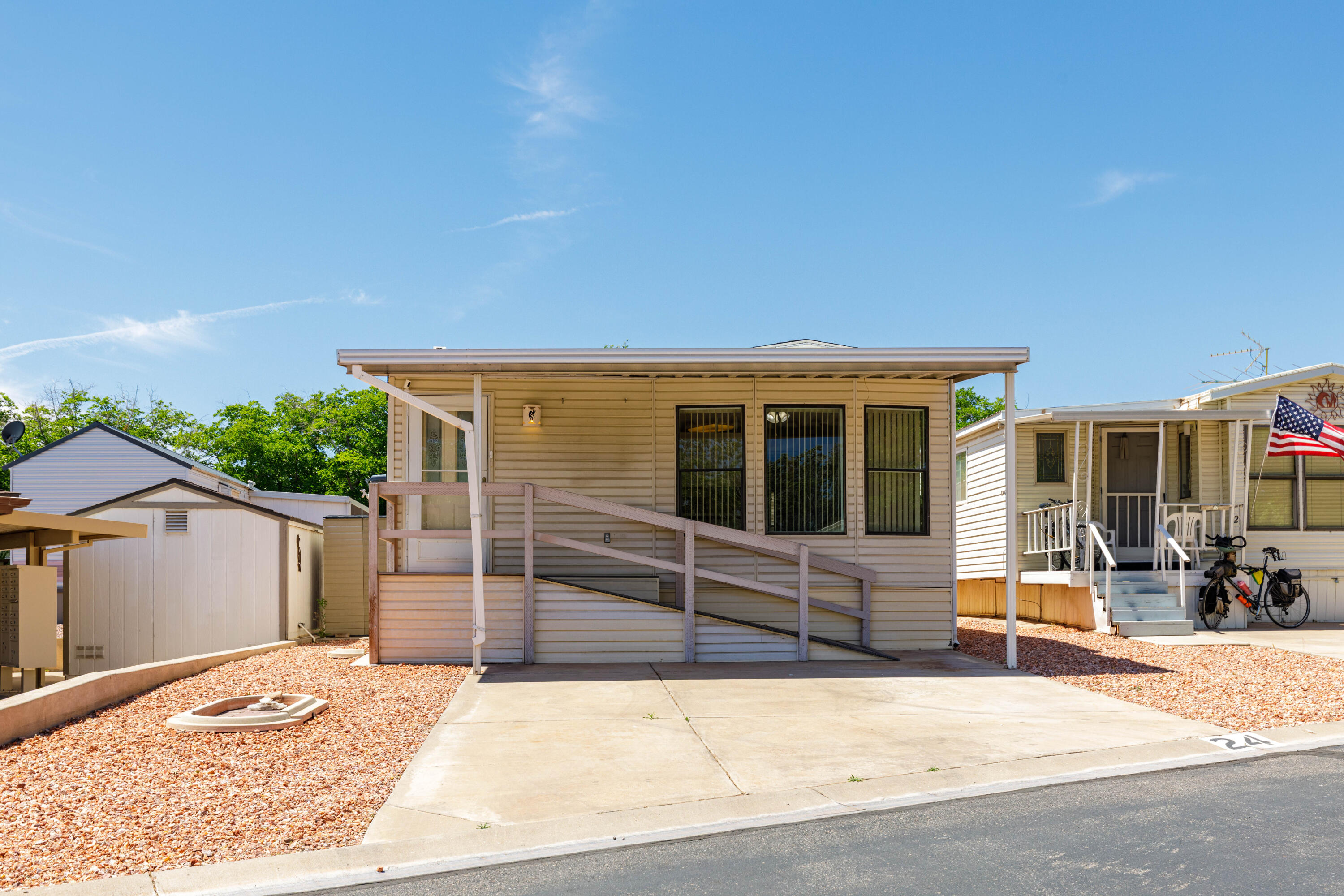 Beautiful remodeled manufactured home located in Canyon Breeze subdivision. New kitchen facets, garbage disposal, and refurbished cabinets. Newer laminate flooring throughout. Recently painted and recarpeted laundry room/storage. New ROOFING and HEATING/AIRCONDITIONING unit with Warranty. Light and bright unit with all the community facilities such as clubhouse, swimming pool, spa, workout gym music room and mail center.