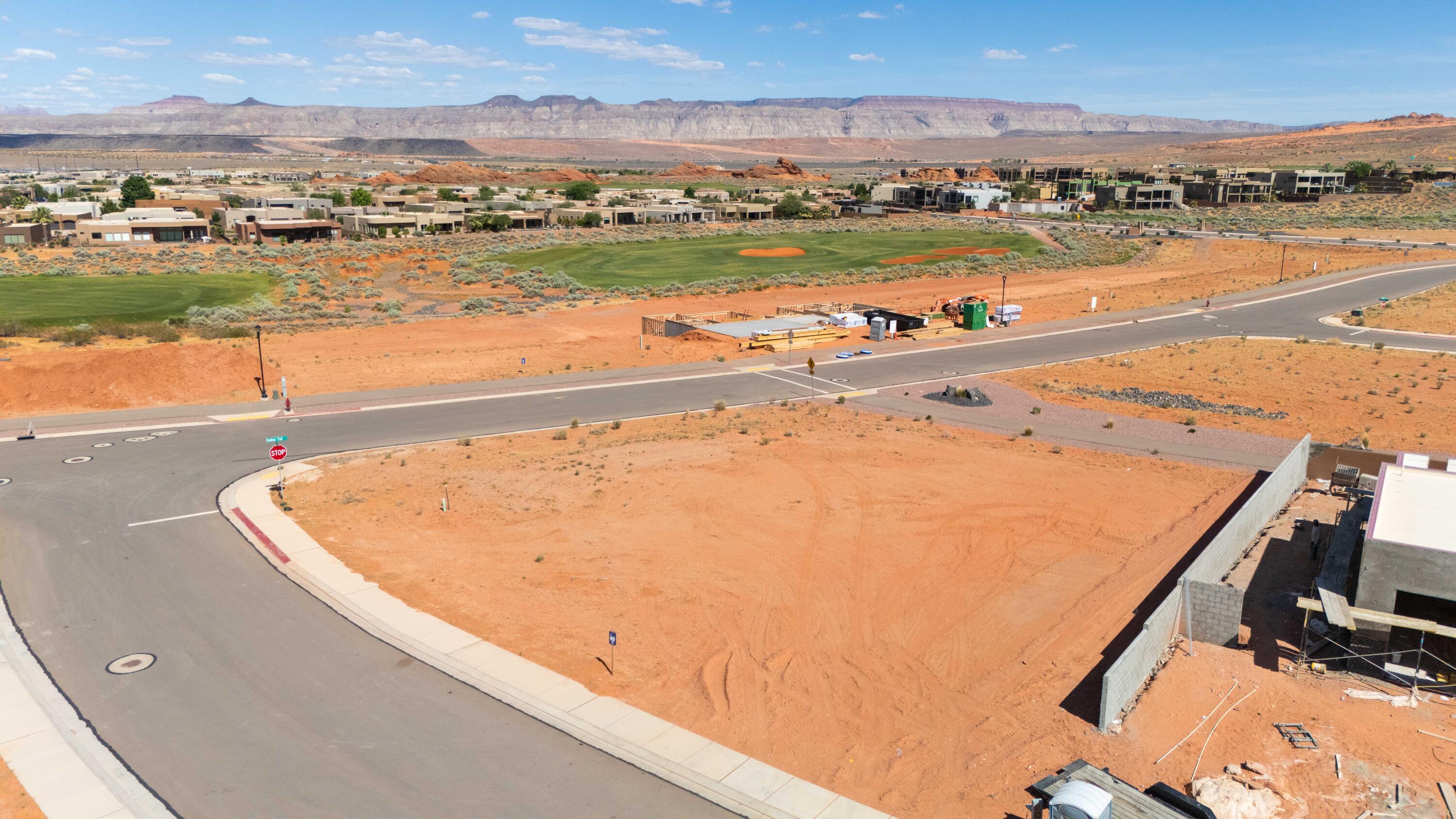 A beautifully proportioned homesite in the heart of Southern Utah's finest community. Lot 69 offers a well-proportioned, pad-ready homesite in The Estates at Sand Hollow Resort, Southern Utah's most prestigious master-planned golf community. At 0.40 acres, the lot provides a comfortable canvas for a custom luxury residence with space for a private pool, outdoor living areas, and oversized garages, all set within one of the region's most coveted addresses surrounded by the dramatic red rock desert landscape that defines this corner of the American Southwest.

What makes this lot especially appealing is its corner positioning. A beautifully landscaped common area walking path runs along the back of the property, meaning there will never be a home directly behind you. As a corner lot, Lot 69 shares a boundary with only one neighboring home instead of three, delivering a level of privacy and open space rarely found in the community.

The Estates has hosted multiple Parade of Homes events with showcase homes selling to discerning buyers. The Championship Course, consistently ranked among the Top 50 Resort Courses in the United States by Golfweek, is steps away along with The Links Course and Wee Course. A new regional hospital, new Hurricane schools, and two destination resort developments with water parks are all underway nearby.

Sand Hollow State Park is directly across the street. Zion National Park is under an hour. Brian Head Ski Resort and Lake Powell are within easy reach. Ownership includes 40% off Championship Course green fees, discounts at The Grille, the Pro Shop, and 10% off Mad Moose UTV rentals. HOA covers landscaping and hourly security patrol. Premier approved builders available or bring your own. 15 minutes to St. George Airport. 90 minutes to Las Vegas.