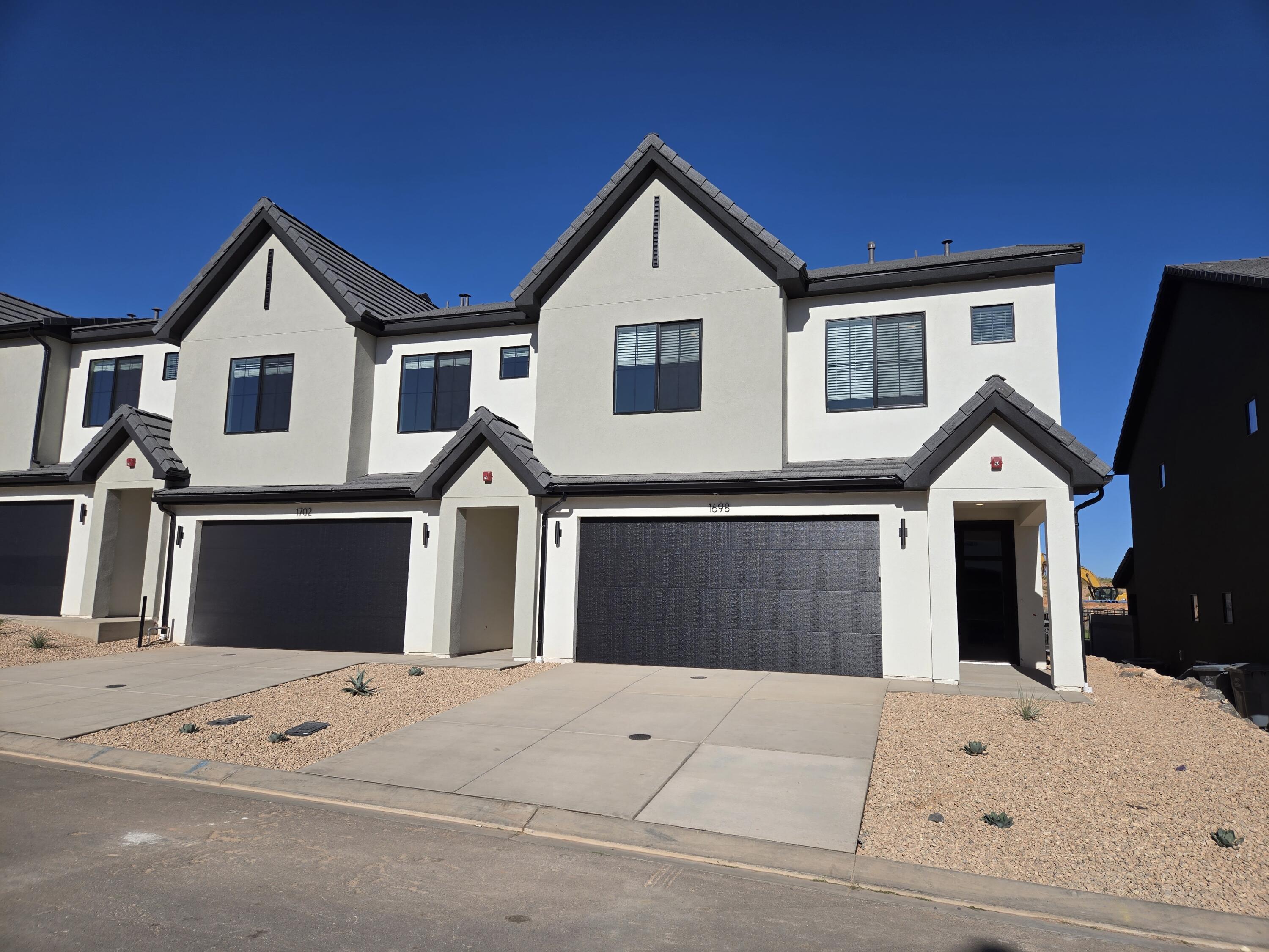END UNIT NIGHTLY RENTAL APPROVED, completion Dec/Jan! You'll find a smartly designed townhome with the Crescent floor plan in our Long Valley community, in Washington City. The Crescent is a 2-story townhome with 4 bedrooms, 4.5 baths, a 2-car garage. On the first floor, the home can be accessed through a covered front porch, or a garage that leads to the kitchen. The main living space is an airy, open-concept kitchen, nook and family room with plenty of space. The attractive kitchen has a large center island, stainless steel appliances such as a dishwasher, range, and microwave as well as shaker-style cabinets. A covered patio on the main floor provides shade for outdoor dining and relaxing A highlight of the Crescent floor plan is that each of the second floor's four bedrooms has its own en suite bathroom, which lends the home to use as a short-term rental property. The second story also has a loft space that can serve as a gathering or media area, and a laundry room ideally placed near all the bedrooms. For those seeking both privacy and room to gather, the Crescent floor plan in Long Valley provides both. Enjoy the community pool, pickleball courts, outdoor ping pong & cornhole, children's playground, and more! Ask me about our included generous home warranty and smart home package! Receive $13,000 toward closing costs with our preferred lender DHI Mortgage! The actual home may differ in color, material, and/or options. Interior pictures are of a finished home of the same floor plan and the available home may contain different options, upgrades, and exterior color and/or elevation style. Square footage figures are provided as a courtesy estimate only and were obtained from building plans.