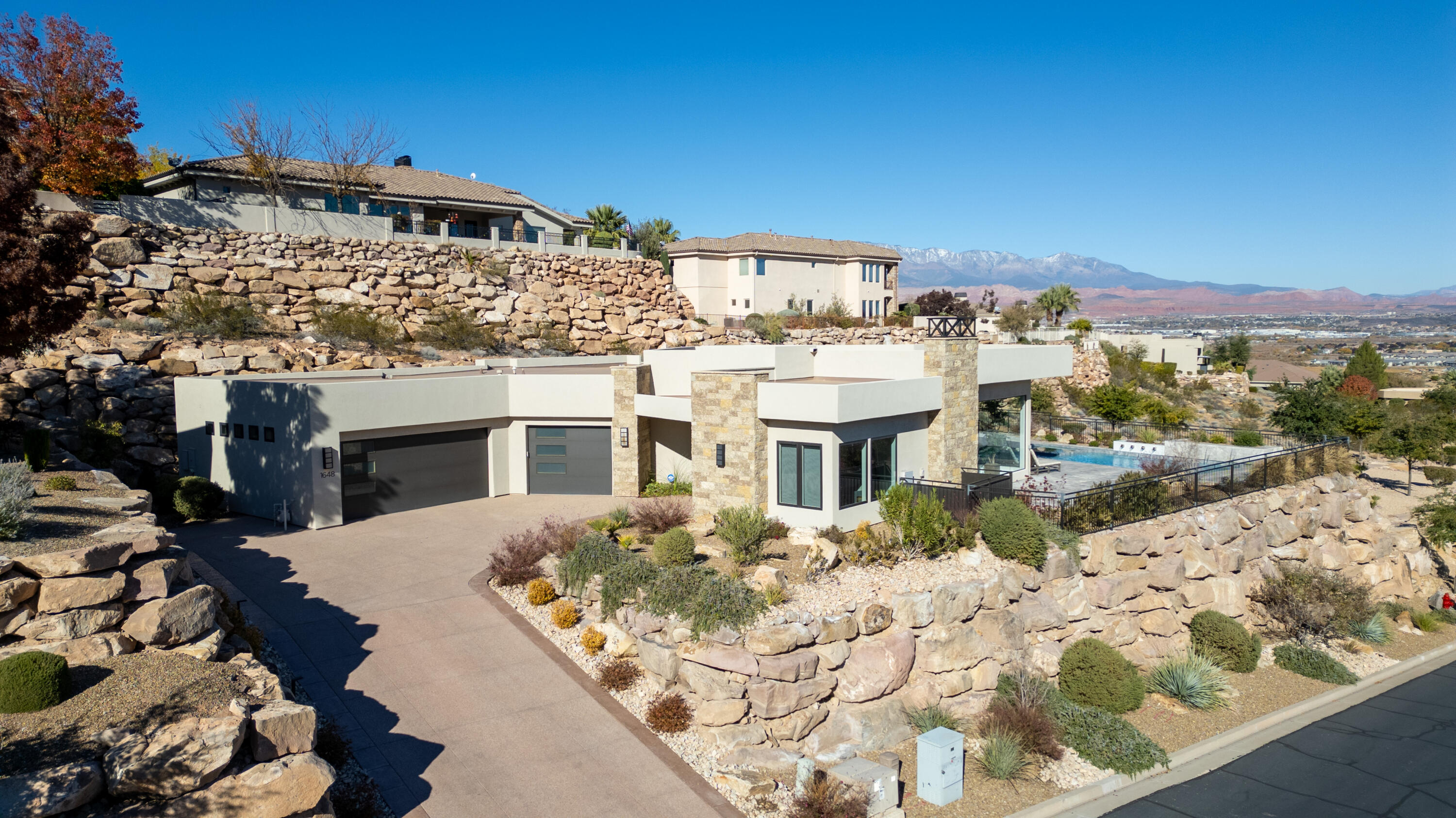 Offered ''Turn Key'' fully furnished & decorated. Located in the premier gated community, Stone Cliff with views to the NE and borders a protected open space which offers unobstructed Mountain Views & City lights. Everywhere you look, you will be pleased with the attention to detail. The Kitchen, Family, Dining & Primary Bedroom all face toward the NE where the amazing salt water pool & water feature is the focus. Thermador Double Overs, Microwave, Full Fridge & Freezer. There is tons of storage in the Kitchen. Outside to the West (off the guest rooms) features a spacious covered patio with built in kitchen, lots of seating for gatherings or a relaxing movie outside for two. To top it off there is a beautiful pool with water features within the pool, also included is a Shamu shelf and a built in spa. This home has been used as a second home and is like brand new. The home borders an Open Space Park which will never be built on and offers privacy and expansive views.   
Please ask your agent for the list (Exhibit A) of items to be excluded: All kitchen dishes, flatware, Traeger BBQ and Omni Pizza Oven, some personal art & decorations, all items in closets, drawers, pantry & garage.
Easy to show on short notice.