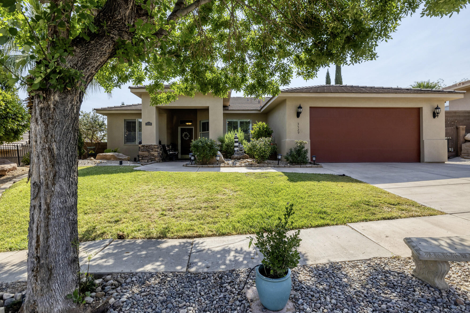 Ideally located near schools, parks, and shopping, this well-maintained home offers comfort, convenience, and beautiful mountain views. The open-concept floor plan features a spacious living room and gathering area, perfect for everyday living and entertaining. Major updates include a newer AC, furnace, and water heater--all less than one year old. Plantation shutters add charm and style to the front of the home. Step outside to a private backyard oasis with plenty of afternoon shade, stunning Pine Valley Mountain views, a covered pergola, and a Bullfrog hot tub--all included. A 16' x 6' storage shed provides additional space for tools, hobbies, or outdoor gear.