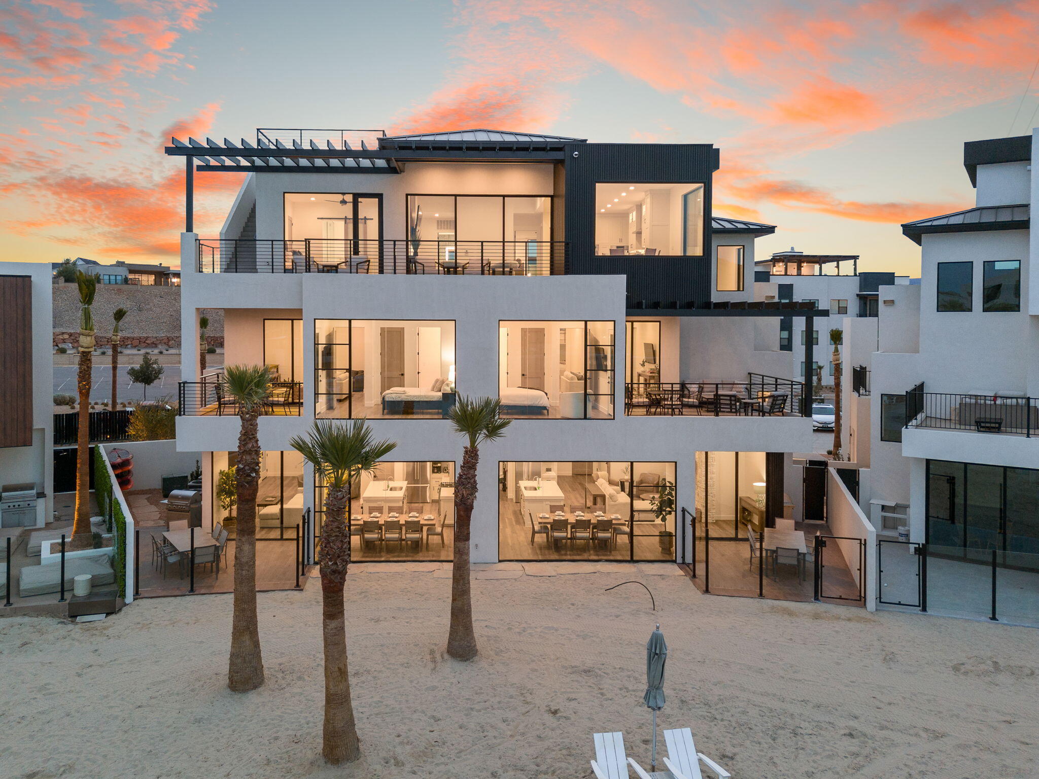 Positioned right on the lagoon in one of the most active and in-demand areas of Desert Color, this is a rare opportunity to own a true waterfront asset in a community that continues to lead the short-term rental market in Southern Utah.

What makes this property different is how it's built. It's designed with three separate living environments that can operate independently or all come together as one. That gives you real flexibility, whether you're hosting large groups, accommodating multiple families, or looking to maximize rental performance without sacrificing the experience.

The layout just works. You've got multiple kitchens, multiple living spaces, and a floorplan that allows people to be together without feeling on top of each other. That's what drives better stays, better reviews, and ultimately better income.

At the top, the private penthouse is a standout. It has its own entrance and captures some of the best views of the lagoon, this is the space that sells the property and keeps guests coming back.

You're also right where you want to be,front and center on the lagoon. This is where the energy is, where people gather, and where demand stays consistent. Desert Color continues to deliver with its 2.5-acre lagoon, sandy beaches, paddle boarding, pools, hot tubs, pickleball, and more, all just minutes from I-15 and downtown St. George.

This isn't just another rental. It's a well thought out, high performing property in one of the strongest communities in the market.