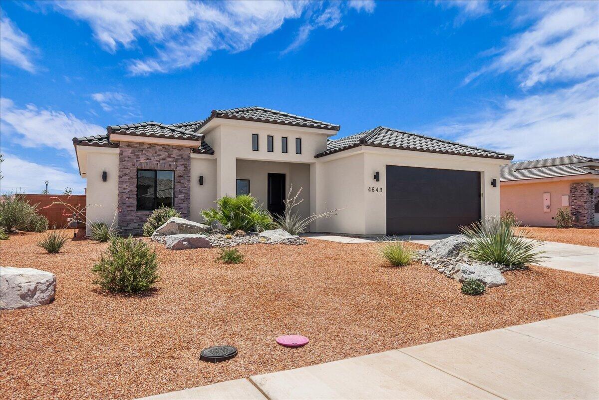 Step inside this beauty and you will discover meticulous detail and the feeling of walking into a new home. With a low HOA fee of $65/mo., this home is located in one of the most highly sought after Southern Utah locations and surrounded by spectacular views. Perfectly situated on a large corner lot with enough space on the side to add RV parking. With a functional open concept and split-bedroom floor plan, this well-appointed home features premium finishes including: 10' ceilings, master suite with walk-in closet, kitchen island with large granite sink, brushed nickel faucet, brass cabinet hardware, upgraded 42' kitchen cabinets, quartz countertops, timeless waterproof durable flooring, stainless steel Frigidaire appliances, walk-in pantry, reverse osmosis, water softener system, newer washer and dryer, ceramic tinted back windows. All appliances convey. The beautifully xeriscaped private backyard retreat offers amble space for entertaining and relaxing. Spend your afternoons enjoying golf at The Golf Course at Sand Hollow Resort or explore Sand Hollow State Park & Reservoir/Lake which features 62,000 acres of open sand dunes and technical trails popular for off-roading, biking and hiking. All this just minutes from your next home!