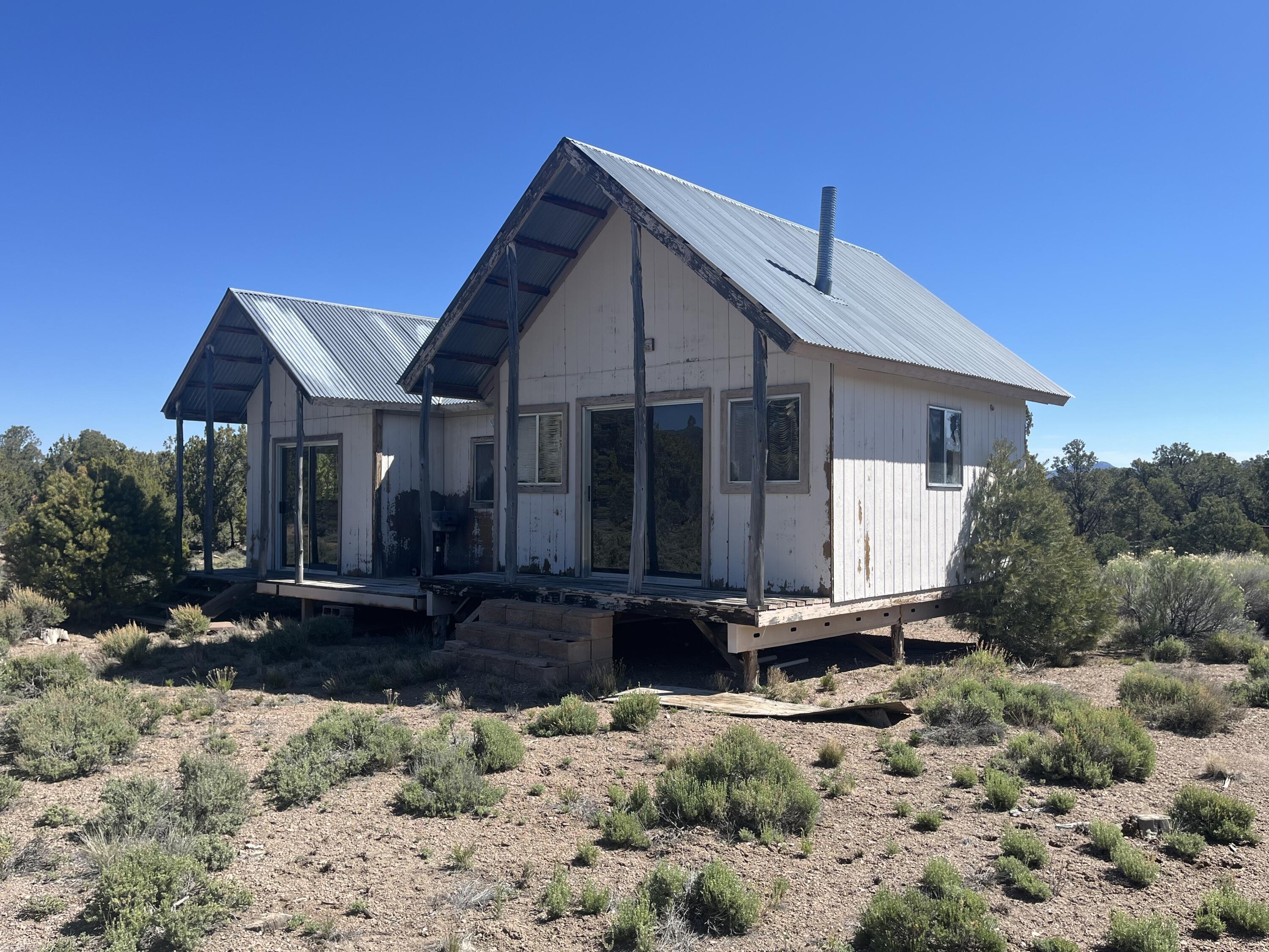 Very rare 20 acres in Hamlin Valley!! Property comes with a small home that was built in 1997 that is 560 sqft that needs completed. Home is currently run on a generator. No water rights or well on property. There is a big water tank next to the home.