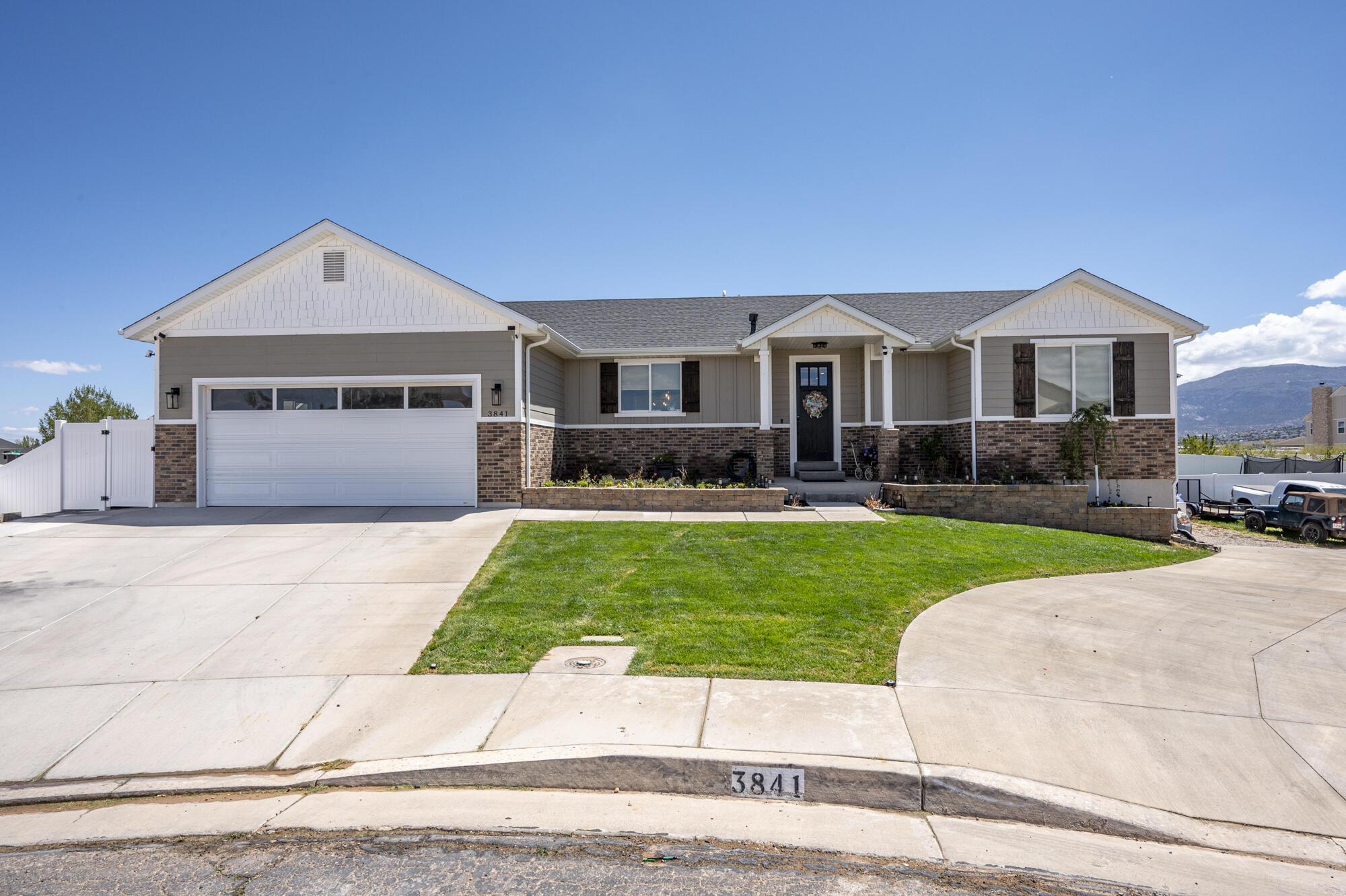 Welcome to this beautifully maintained home tucked away in a quiet cul-de-sac with minimal traffic and an abundance of space both inside and out. Thoughtfully designed with an open-concept layout, this home features a stunning kitchen with quartz countertops, custom cabinetry, stainless steel appliances, and a spacious island perfect for gathering. The inviting living room showcases a beautiful stone fireplace with custom built-ins and large windows that fill the home with natural light. The spacious primary suite offers a spa-like bathroom with dual vanities and stylish finishes, while the fully finished basement provides additional room for entertaining, relaxing, or hosting guests. Outside, enjoy a fully fenced and finished backyard complete with a covered patio, lush lawn, storage shed and plenty of space for outdoor living. With ample parking and room for all your toys, trailers, and storage needs, this property offers the perfect blend of comfort, functionality, and location