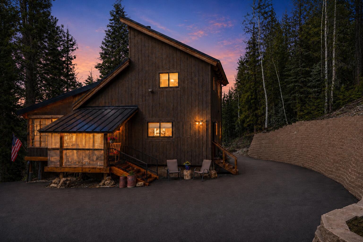 Tucked away on three combined lots totaling almost 2.5 acres, this beautifully modern cabin offers every convenience wrapped in a peaceful mountain setting. Bright, open, and thoughtfully designed, it's the perfect blend of style and comfort. One of the standout features is the stunning sunroom- a light-filled space ideal for morning coffee, cozy evenings, or simply soaking in the serene surroundings year-round. The new pull through 40x50 garage is equally impressive, featuring 100,000 BTU heaters, a private bathroom, a dedicated workshop area, and a spacious loft for storage, studio space, or more. Whether you're storing your toys, working on projects, or dreaming up your next adventure, this garage is ready! Since the photos were taken, a blacktop driveway and a retaining wall have been added, enhancing both functionality and curb appeal. For buyers looking to expand, the seller has thoughtfully had plans designed for an 800 sq ft addition - available for review if you're ready to take this already incredible property to the next level. Don't miss the chance to own a truly move-in ready modern mountain retreat with room to grow!