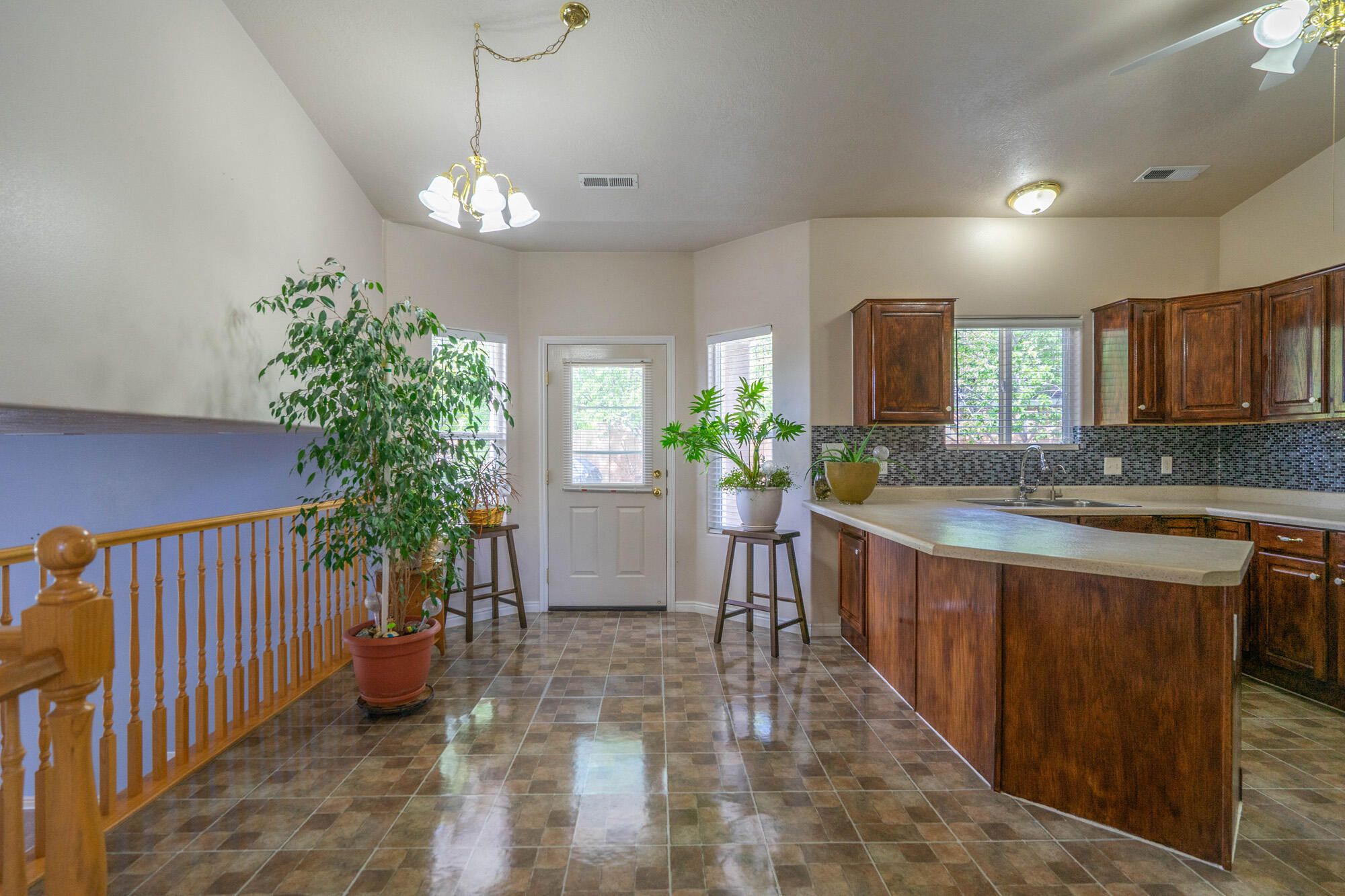 Beautiful tri-level home. featuring ceiling fans in every bedroom, a finished basement, and a whole home sound system wired for both indoor and outdoor entertainment. Enjoy convenient RV parking with sewer access. The spacious backyard offers a refreshing pool and ample patio space, perfect for relaxing, entertaining, and enjoying outdoor living.