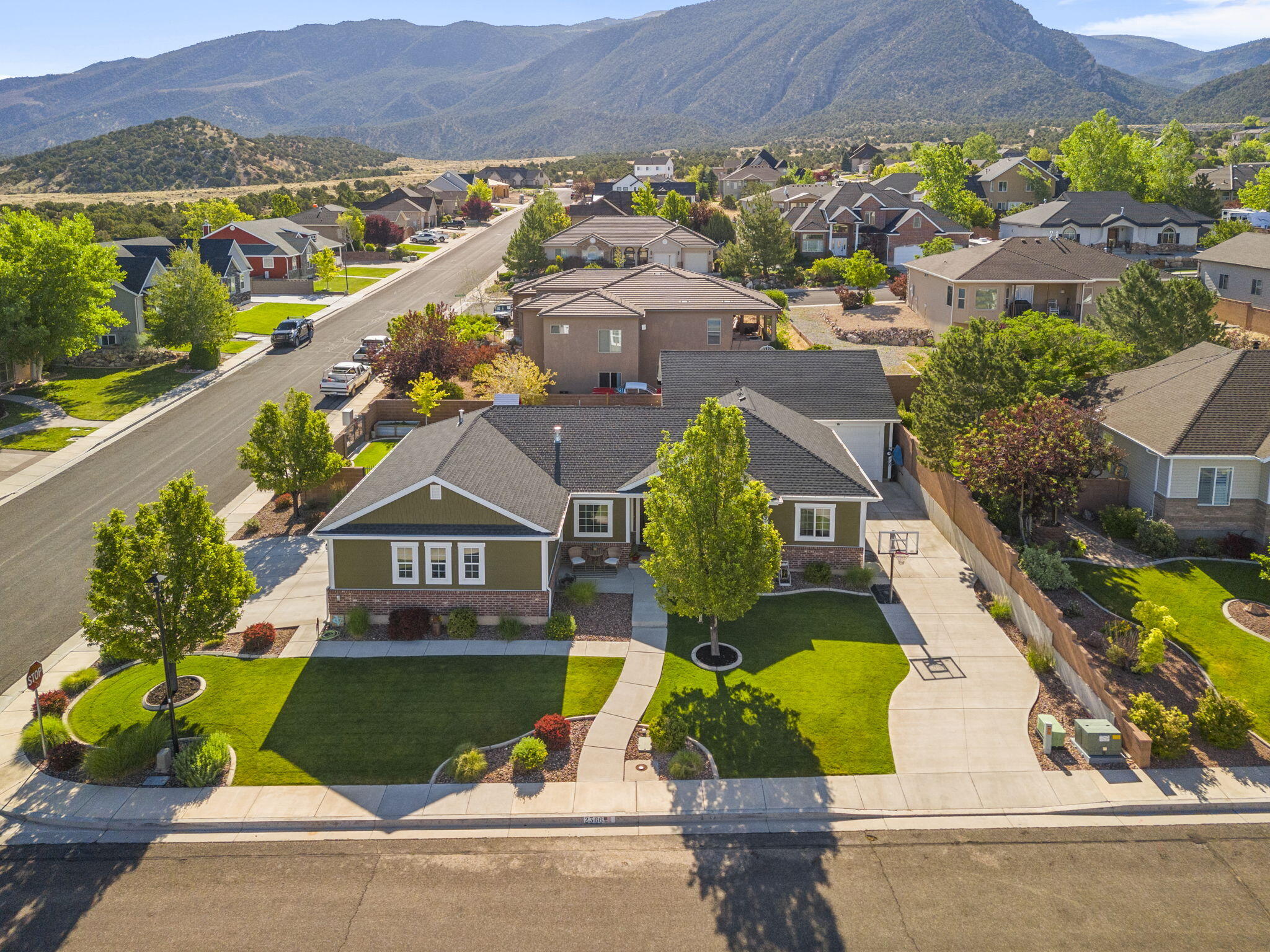 Beautiful 6-bedroom, 3-bathroom home offering 3,178 square feet of living space on a 0.25-acre lot in the established Canyon Gate subdivision. One of the property's standout features is the detached 1,100 sq. ft. heated shop offering year-round functionality for work, recreation, equipment storage, or workshop use. Fresh interior paint and a fully finished basement add comfort and functionality throughout the home. The property is fully landscaped and includes a hot tub, creating an ideal space to relax and enjoy the mountain views. With no HOA, homeowners have added flexibility and fewer restrictions. Conveniently located in a well-established neighborhood, this home offers generous living space and a desirable setting.