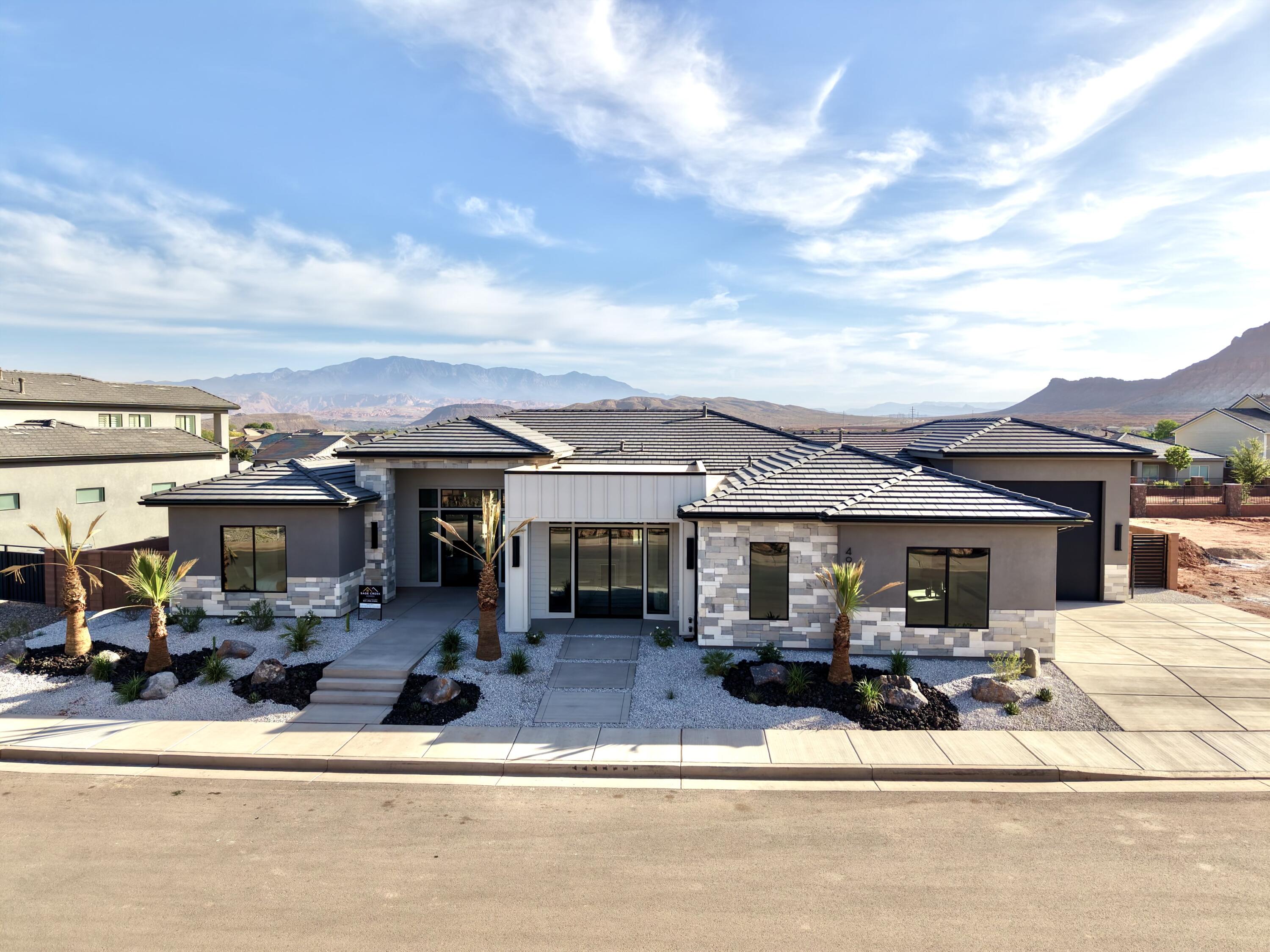 Elevated lifestyle is exactly what this beautiful home has to offer.  Large windows show off stunning views of the pool, backyard space and beautiful mountain scenery.  There is a gate walking out to the perfect path for your evening stroll.  Inside the home is a dream with a custom gourmet kitchen, butler's pantry, 3 bedrooms in addition to the master all with en-suite baths and a really cool master closet.  Tile and accent walls make this home a remarkable show piece!  Not to mention the neighborhood and amenities make this not just a home but a lifestyle!