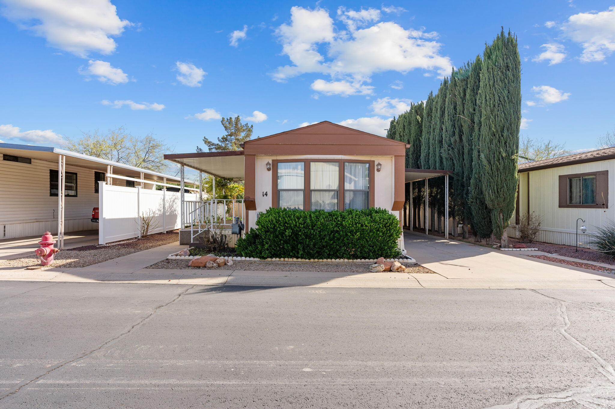 Discover this well-maintained 1992 Nashua home, showcasing pride of ownership in the desirable Paradise Palms 55+ community. The HOA fee covers lot rent, basic cable TV, and common area maintenance, ensuring a hassle-free lifestyle.
Home Features: Thoughtfully designed 2-bedroom layout, with bedrooms located on opposite ends for added privacy. Tandem 2-car carport plus a storage shed for extra convenience. Low-maintenance yard, perfect for seasonal or full-time living--no lawn mowing required! Prime Location: Minutes from shopping, medical facilities, restaurants, and scenic walking trails. Important Details: ALL buyers must be HOA-approved before the seller can consider an offer.