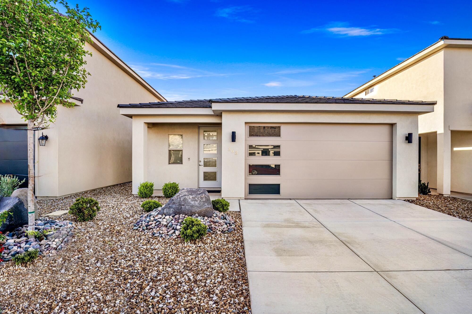 Picture yourself waking up in this stunning almost-new 2-bed, 2-bath home, then heading out to explore world-class recreation right in your backyard ! This meticulously maintained gem is your gateway to adventure--whether you're casting a line at Quail Creek's year-round warm waters, cliff jumping at Sand Hollow Reservoir, hiking the scenic Virgin River Trail System, or teeing off at nearby golf courses.

Inside, you'll love the beautiful waterproof LVP flooring that stands up to your active lifestyle, rich pecan cabinets, and a luxuriously upgraded master bathroom that feels like a spa retreat. All appliances are included--refrigerator, washer, and dryer--so you can move in and start living immediately. The spacious walk-in closet next to the laundry room and garage means all your gear and adventure equipment have a perfect home.

Unwind on your private enclosed back patio after a day of exploring nearby State and National Parks. The low-maintenance exterior landscaping gives you more time to enjoy what matters most--living the Southern Utah dream! Whether you're a first-time buyer ready to plant roots, seeking a sun-soaked second home, or embracing the retirement lifestyle you've earned, this charming single-level home delivers it all.

Location perfection: Close to schools, parks, shopping, endless biking/hiking trails and access to 2 nearby lakes!

BONUS: Powered by Dixie Power--with electricity rates 45% below the national average, you'll enjoy some of the lowest and most stable energy prices in the entire region!