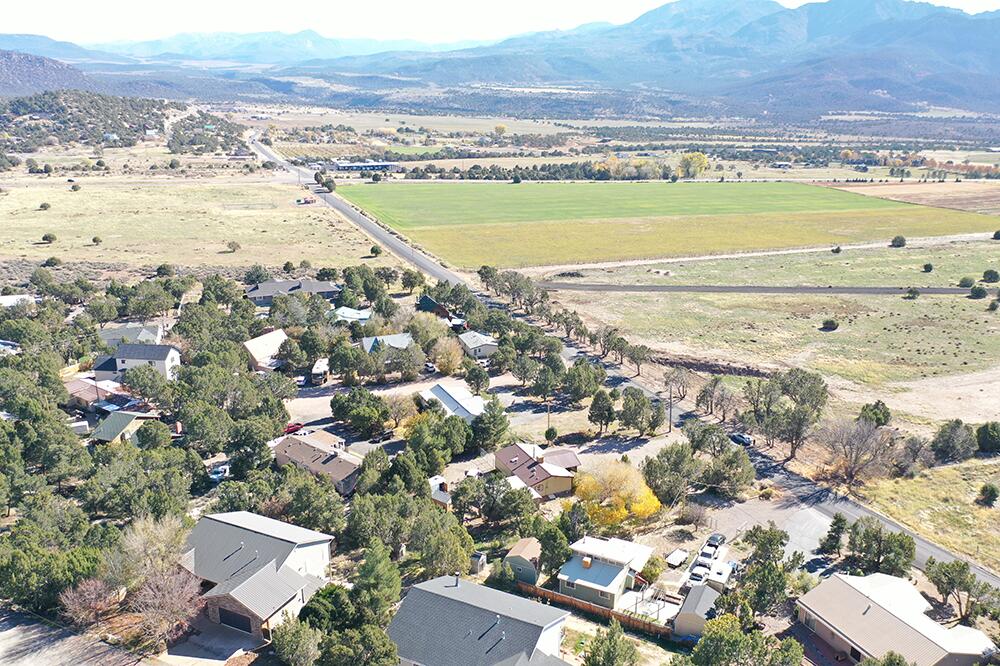 Escape the crowds and enjoy cool Central nights on this flat, usable .22-acre lot with trees. With land getting so expensive, this is a perfect corner lot with endless options and priced perfectly. Only about 27 miles to St. George, 15 miles to Enterprise and 8 miles to Pine Valley, you're close to services yet far from the hustle. Play all day at nearby Pine Valley, Enterprise, Baker and Gunlock reservoirs, then come home to quiet, wildlife and star-filled skies. There are no improvements to the lot but everything is close to connect and be ready to go!