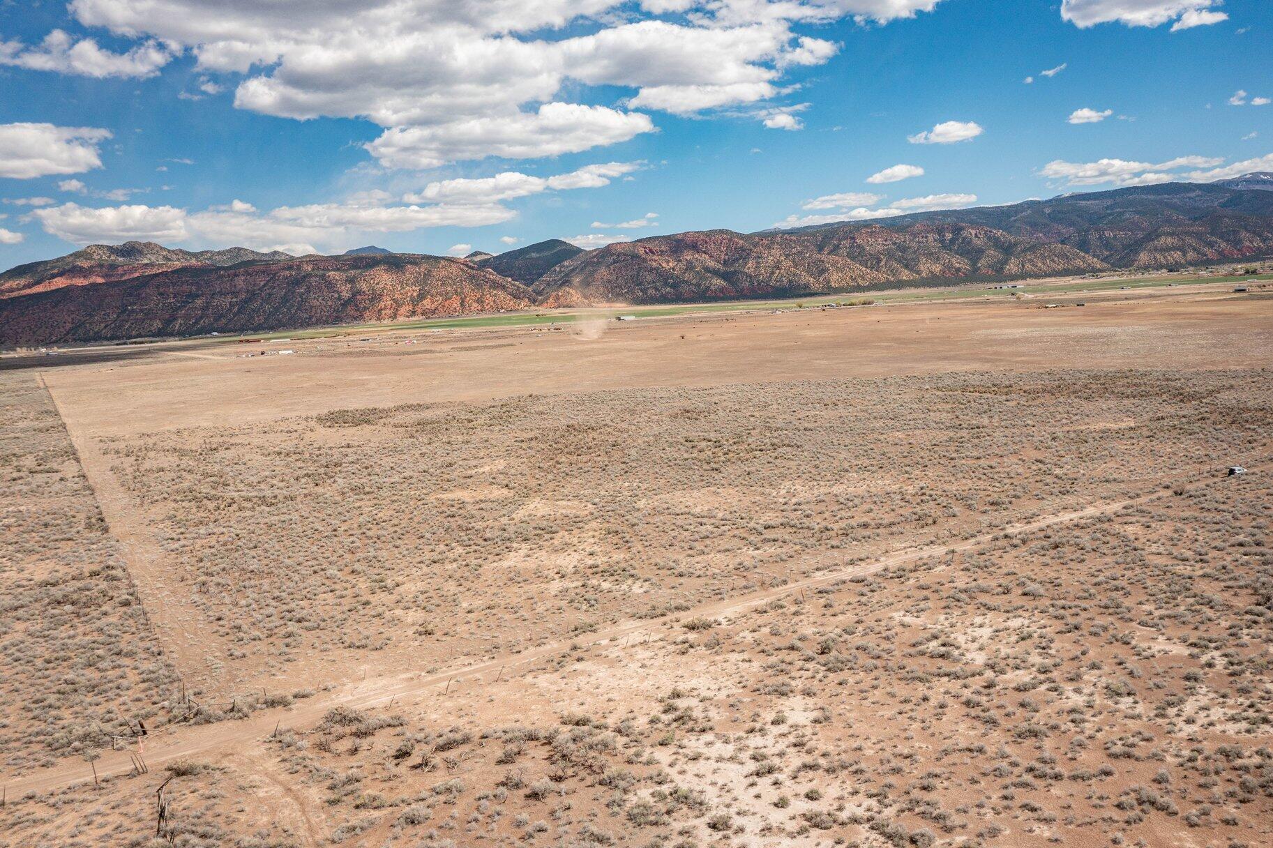 Remarkable opportunity to own a 20-acre parcel just off exit 82 on i-15 for Paragonah. With stunning mountain views and ready for you to build your perfect oasis. Zoned as A-20. Each lot comes with 1 acre-feet of water right. Parowan is an incredibly beautiful small town of just over 3,000 residents. Close to Cedar City, which is home to Southern Utah University, and the Shakespeare Festival, as well as some amazing restaurants. As part of Southern Utah, you will experience a lifestyle like no other. The area features nearby internationally recognized mountain biking trails, road cycling, hiking, golf courses, national parks such as the Grand Canyon, Zion, & Bryce, plus national moments, national forest, reservoirs, & some of the most iconic desert landscape in the world. Less than 30 minutes from Brian Head Ski Resort, there is no doubt that this is a fun place to live and play.  

All information herein is deemed reliable but is not guaranteed. Buyer is responsible to verify all listing information, including square feet/acreage, to buyer's own satisfaction.