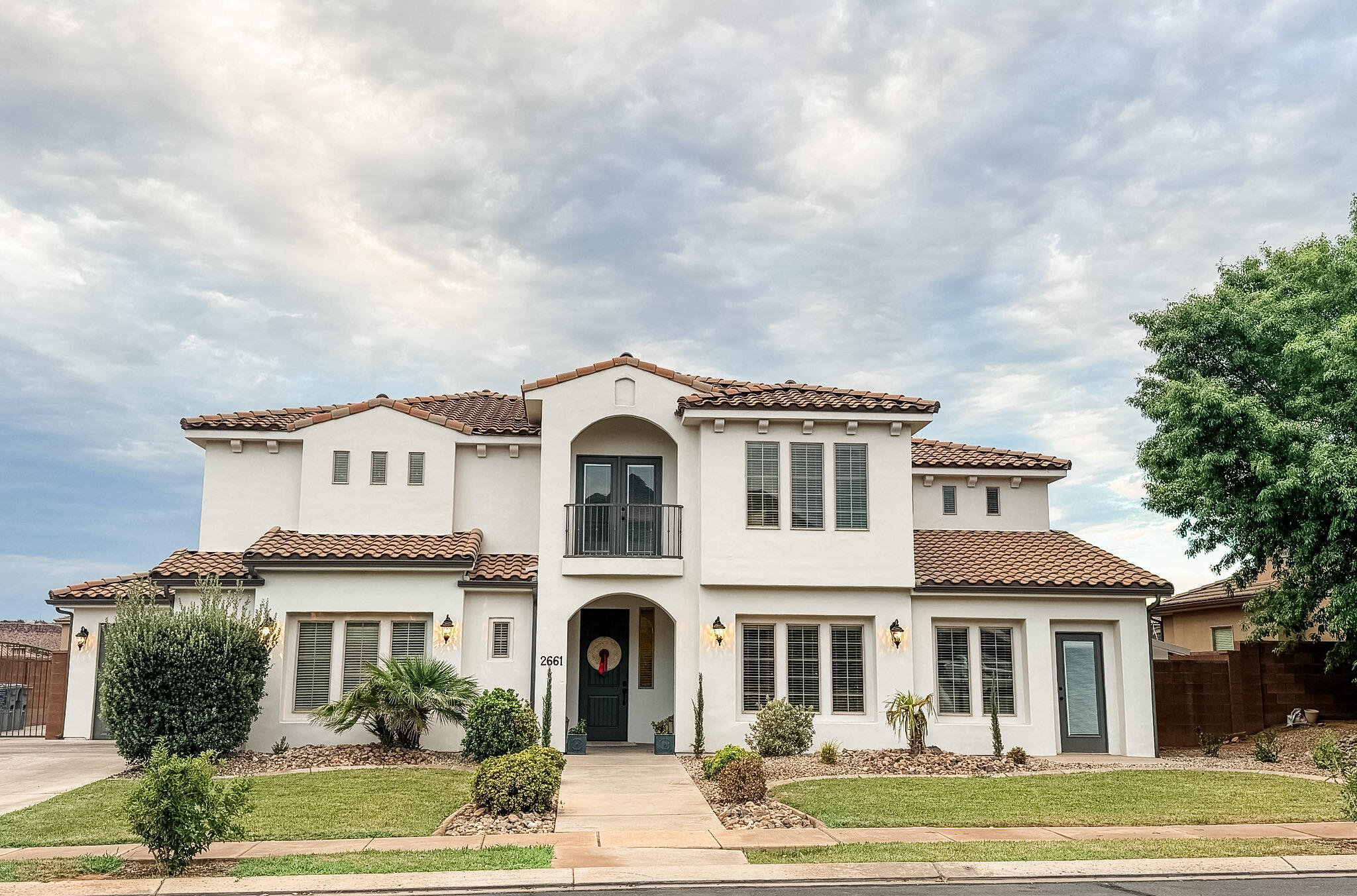 Beautiful remodeled 6 bedroom/4.5 bathroom home in the highly coveted Little Valley area of St. George. The home has been completely remodeled with new flooring, paint, carpet. Step inside to a welcoming entryway that leads to an in-home office. As you move through to the open concept kitchen and living room, notice the thoughtful details of a custom kitchen and butler's pantry. The primary suite features backyard access, a soaking tub, a large shower, and custom his and hers closets. The main floor also features a casita with private bathroom. 

Upstairs you will find a second living room with a balcony overlooking the backyard, as well as a bunkroom with built-in bunkbeds. Two bedrooms share a Jack-and-Jill bathroom, with one bedroom with a balcony to the front yard. Down the hallway, you will find two more bedrooms and one bathroom. Three of the bedrooms offer walk-in closets. 

The backyard features an in-ground trampoline, a checkerboard paver patio area, and a cement pad for sports practice. The home also has RV parking on the side of the house. Two parks within walking distance.