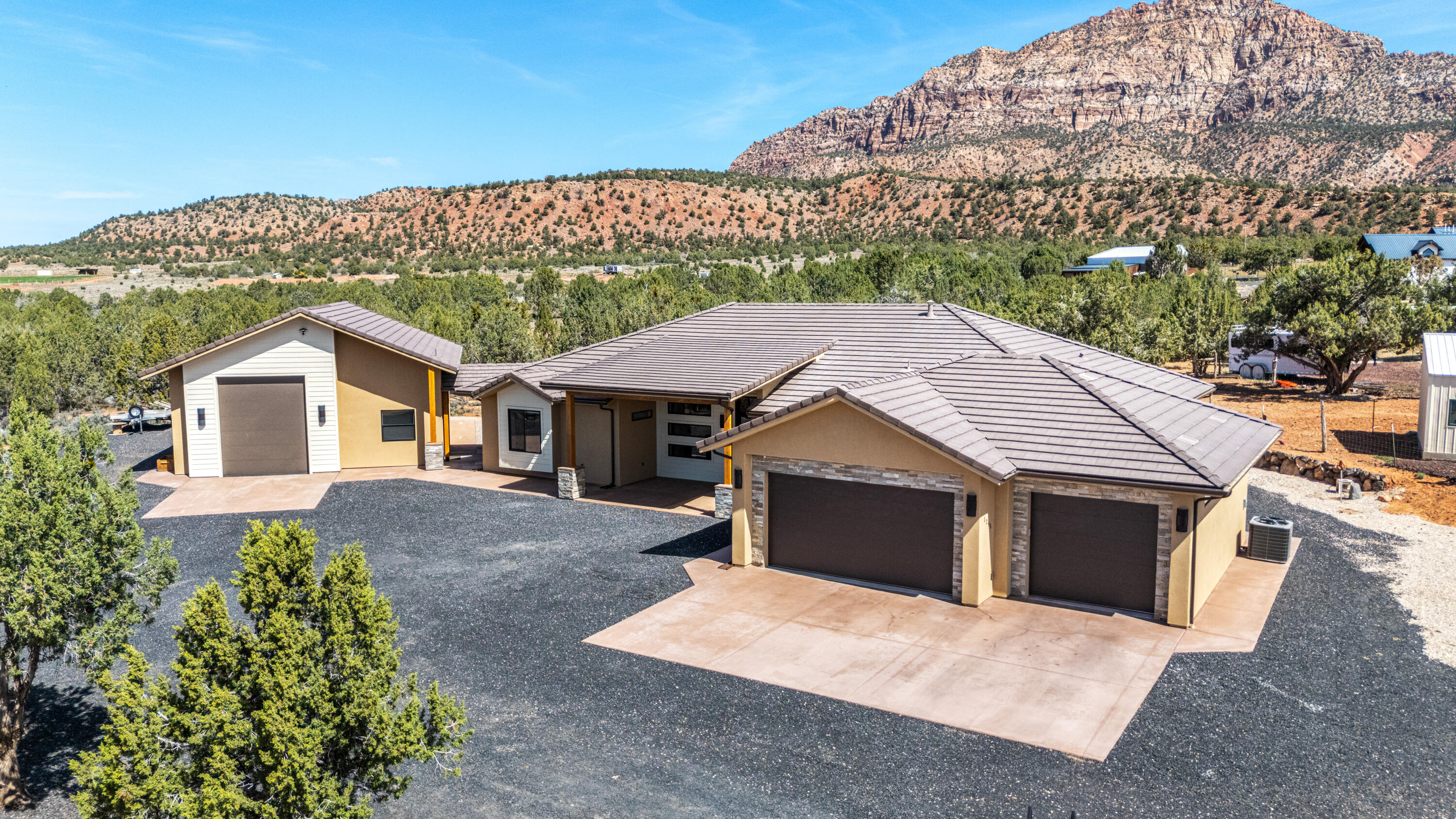Like-new 3,005 sqft home in Apple Valley offering space, privacy, and some of the best views Southern Utah has to offer. Set right beneath Mt. Canaan, this property delivers wide open desert scenery, incredible sunsets, and clear, star-filled nights you just don't get in town. Located in a dark sky community, you'll experience unmatched night skies and peaceful surroundings. Apple Valley is known for its quiet lifestyle, larger lots, and easy access to Zion National Park, making it ideal for those wanting space without being too far from St. George or Hurricane.

This horse property is fully set up with room to expand and use how you want. It includes a large shop with RV-height clearance, plus three separate RV hookups, making it perfect for storing toys, hosting guests, or creating additional income opportunities. The property also features a detached casita, along with an additional detached insulated building equipped with full electric, heat, and AC, ideal for a home office, bunkhouse, playroom, or extra storage.

Inside, the home is clean, modern, and well thought out with exposed wooden trusses, vaulted ceilings, custom walnut cabinetry, re-circulation pumps, a well above standard water filtering system, and a water softener. The insulated garage and garage doors add an extra level of comfort year-round. The layout offers both comfort and functionality, whether you're living full-time, using it as a second home, or maximizing it as an income-producing property.

If you're looking for something that offers land, flexibility, views, income potential, and a true Southern Utah lifestyle, this one checks all the boxes.