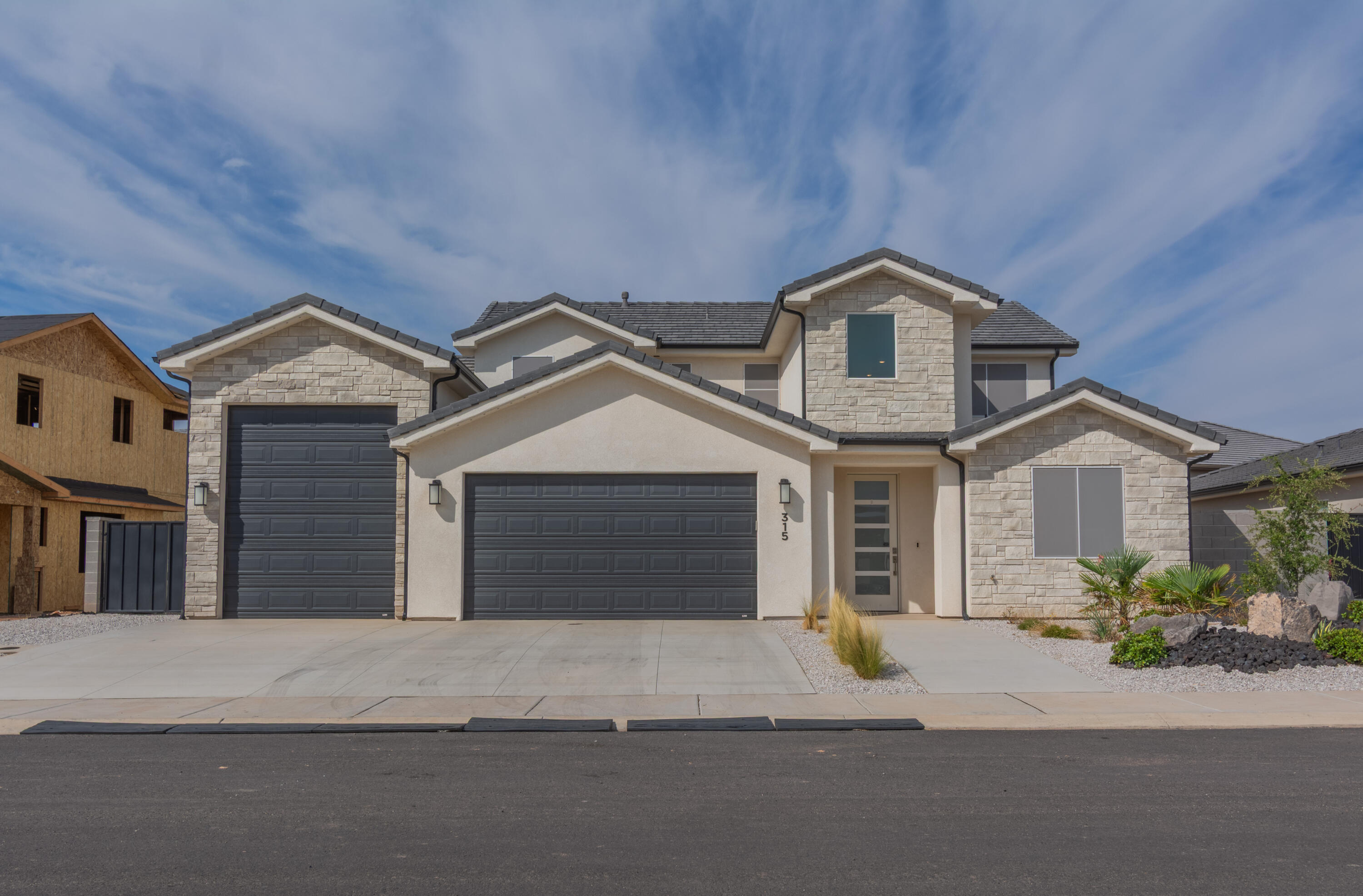 Stunning like-new home in Hurricane! This spacious home offers 5 bedrooms, 4 full bathrooms, plus a dedicated office-perfect for both living and working. Enjoy breathtaking views and plenty of parking with a 2-car garage and an impressive 46' deep RV garage. The RV garage is designed to easily fit all your toys! Covered patio and beautifully landscaped yard. Permanent lights. Nestled in the peaceful Firerock subdivision, just minutes from SR-9, this home combines convenience with quiet living. Don't miss your chance to make this like-new home yours!