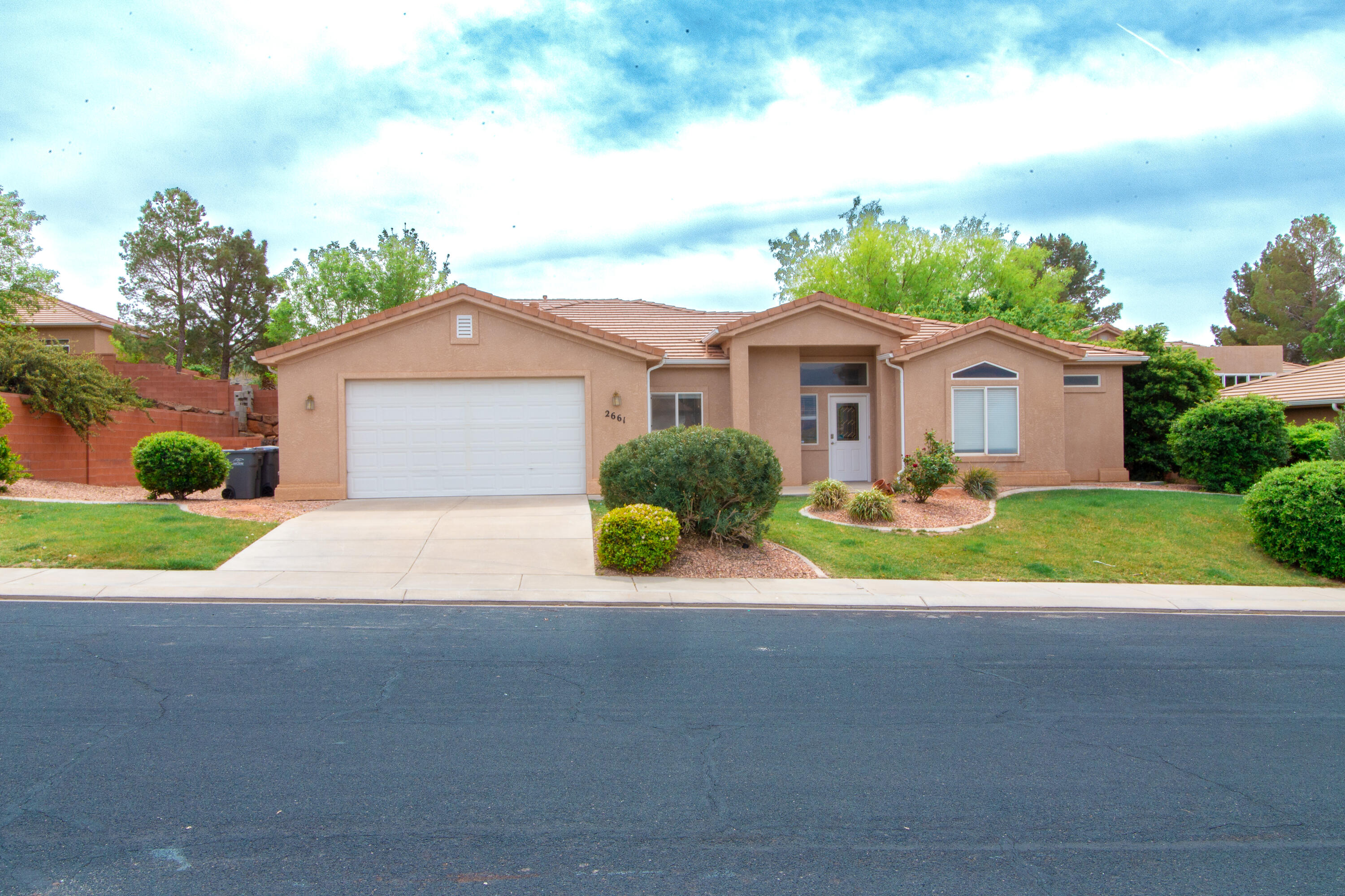 Here is great opportunity to live in the lovely Sky Ridge subdivision. Centrally located, you'll be close area amenities including state parks, off-roading, golf and hiking trails that make the area so desirable. Plus conveniently close to stores, schools, hospitals, and an easy 25 minute drive to the airport. Inside, the super-durable tile floors still look like new. Great room has a gas fireplace and vaulted ceiling. Master bathroom has a separate tub/shower and spacious walk-in closet. The guest bath has plenty of cabinet space. Kitchen appliances are in great condition. Backyard is private, fenced and gated. Plenty of space on the side of the house if you like to convert to RV Parking or other storage.  Backyard trees provide some nice shade and front yard landscaping has been well maintained.