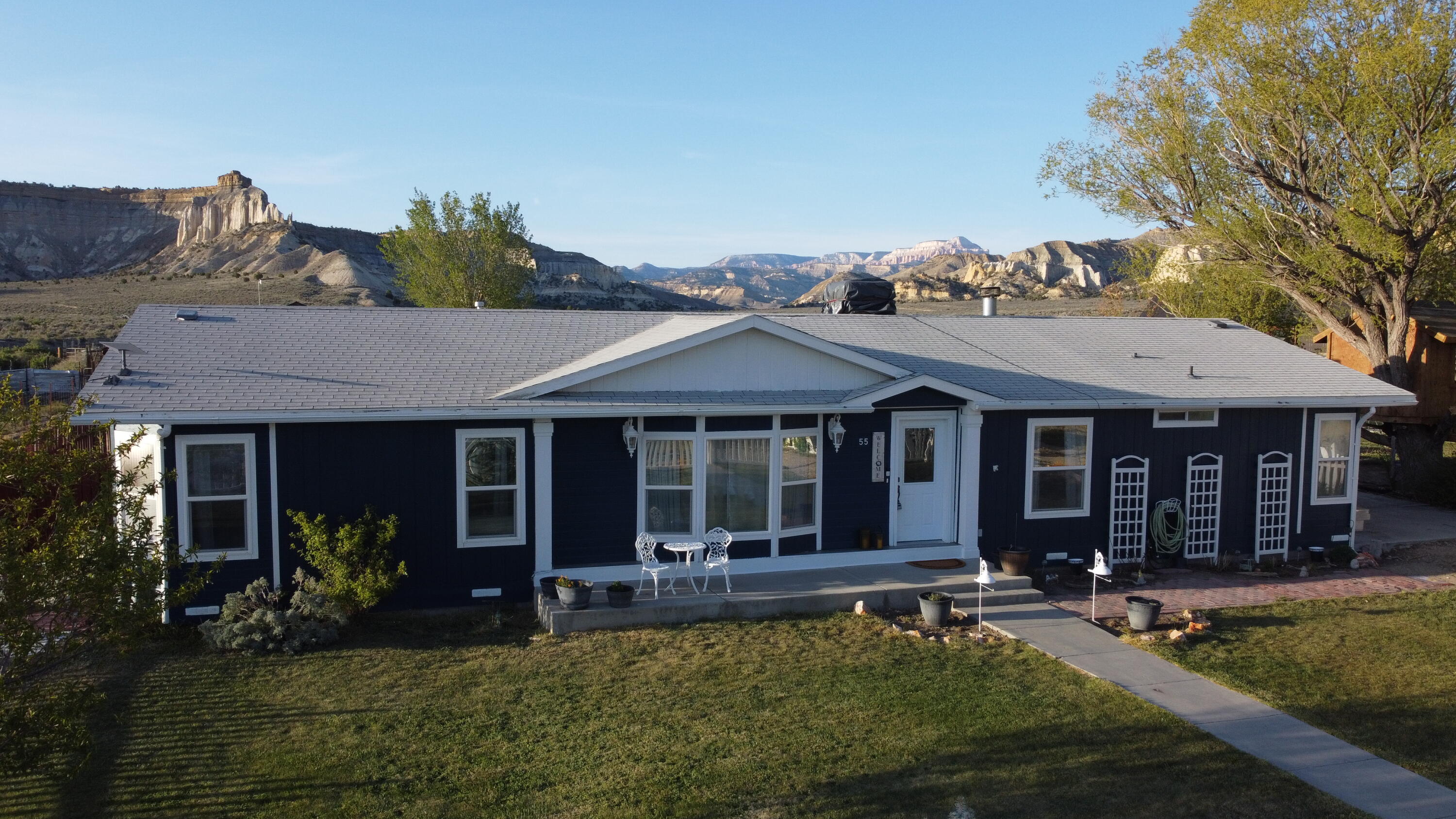 Located in the quiet, welcoming community of Henrieville, this beautifully maintained 3-bedroom, 2.5-bath home offers comfort, space, and unforgettable scenery in the heart of Southern Utah. The home features both a spacious living room and a separate family room, along with a formal dining area perfect for gatherings and entertaining. Durable LVP flooring runs throughout, creating a clean, cohesive look that complements the home's thoughtful layout. Outside, the oversized back porch is a true highlight, providing sweeping views of the surrounding mountains and wide-open skies--an ideal setting for morning coffee or relaxing evenings. While you're out back, enjoy the cozy firepit under the stars and the putting green for sharpening your short game. The exterior's royal blue color stands out beautifully against the lush green grass, creating picture-perfect curb appeal. Situated in a charming small-town, its just over 15 minutes from Bryce Canyon National Park. This property offers peaceful rural living with world-class recreation just minutes away.
