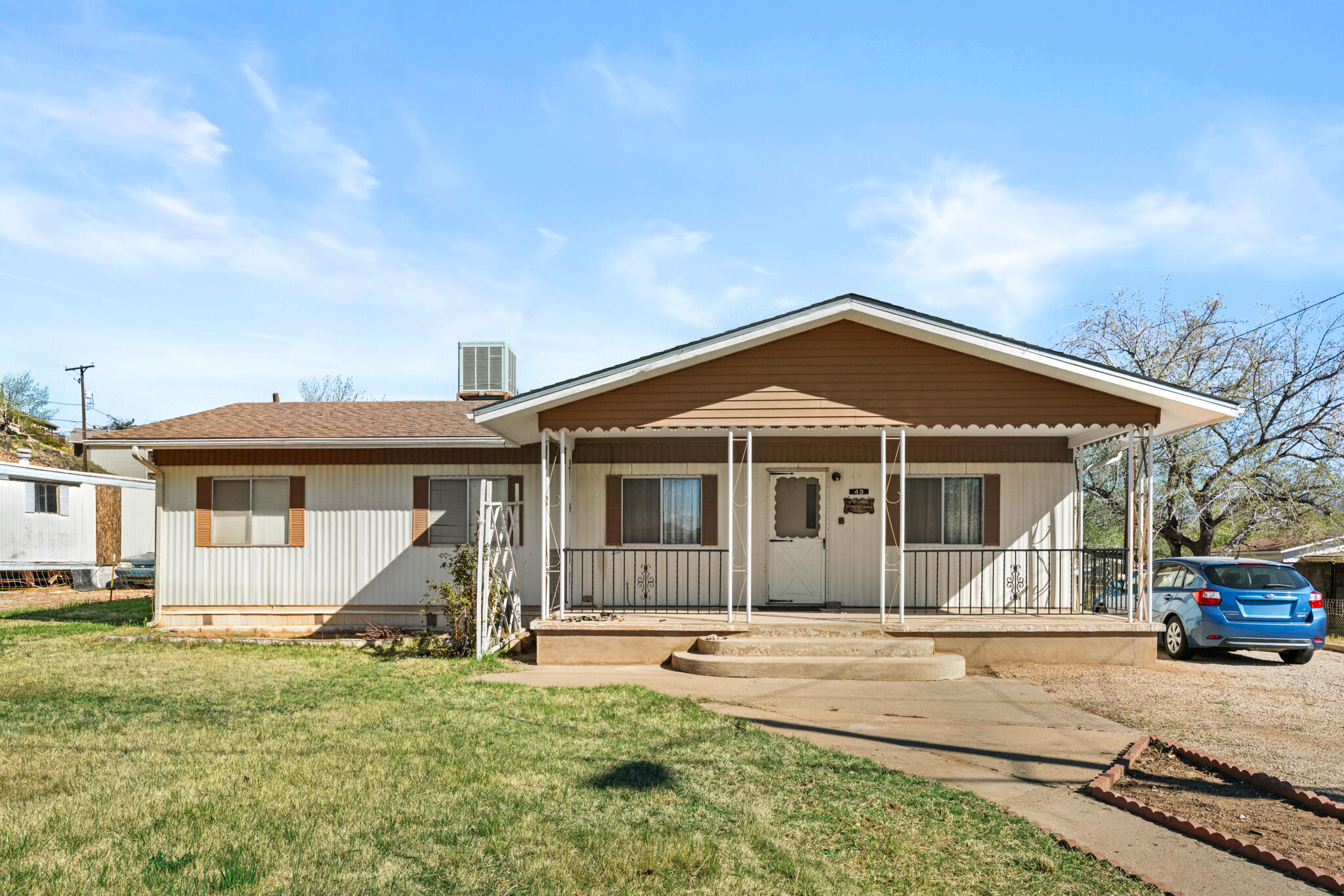 Affordable opportunity with potential! This 2 bed, 2 bath 1977 Hillcrest mobile home offers 1,056 sq ft on a spacious 0.22-acre lot with pressurized irrigation. Features include natural gas heat, central A/C, a small workshop, and plenty of room for RV or extra parking. The home needs updating but could shine with some TLC--great for investors or buyers looking to customize. Roof-mounted evaporative cooler is not hooked up. Sold As-Is and priced accordingly--bring your ideas and make it your own!