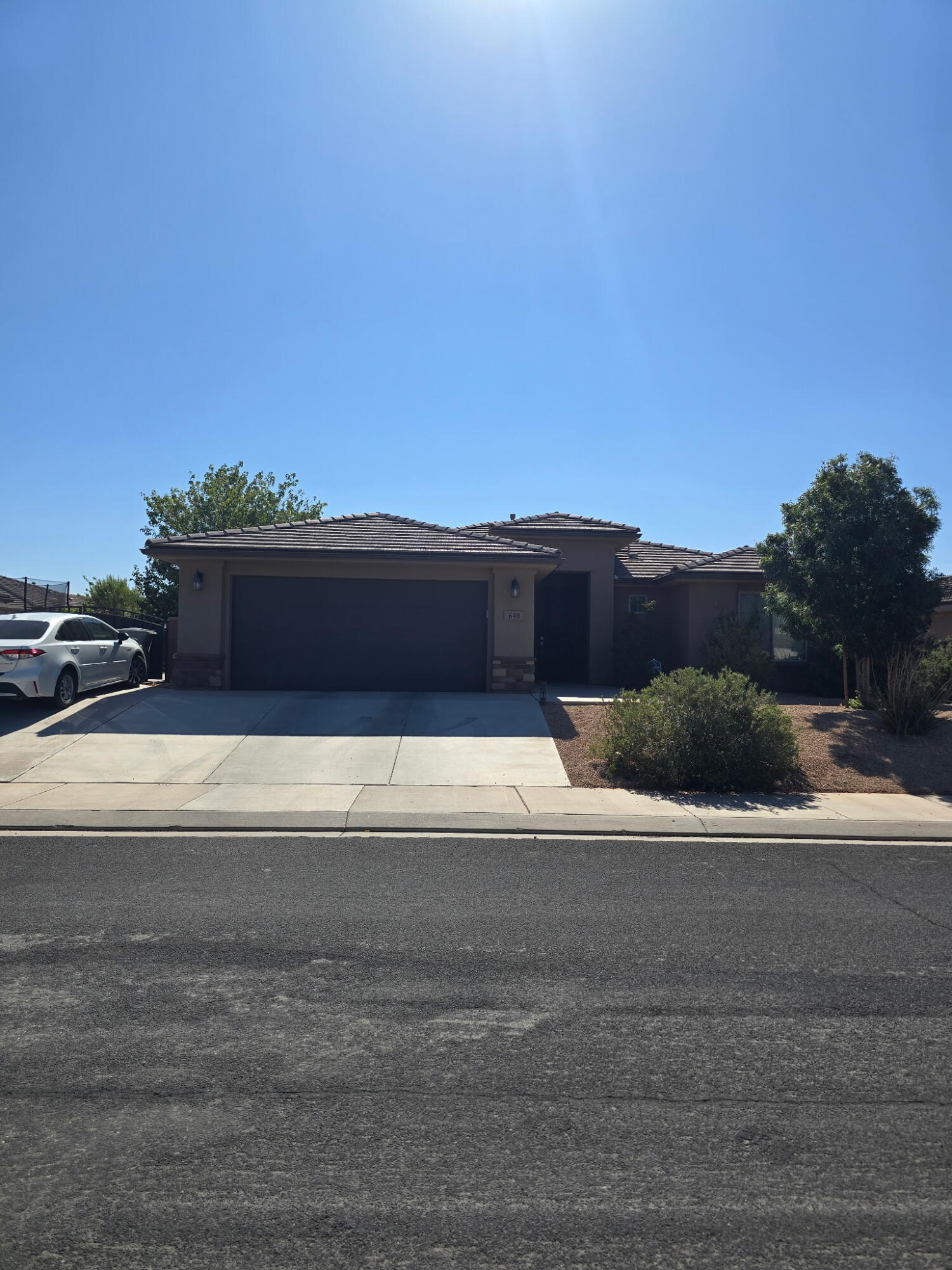 Beautiful 2018 single-level home in Peregrine Pointe featuring an open-concept floor plan, granite countertops, a spacious island kitchen, rich wood cabinetry, and modern finishes throughout. Conveniently located near Sand Hollow, Zion National Park, schools, shopping, and outdoor recreation, this home offers views of the surrounding mountains and comfortable living in a quiet, well-maintained neighborhood.
