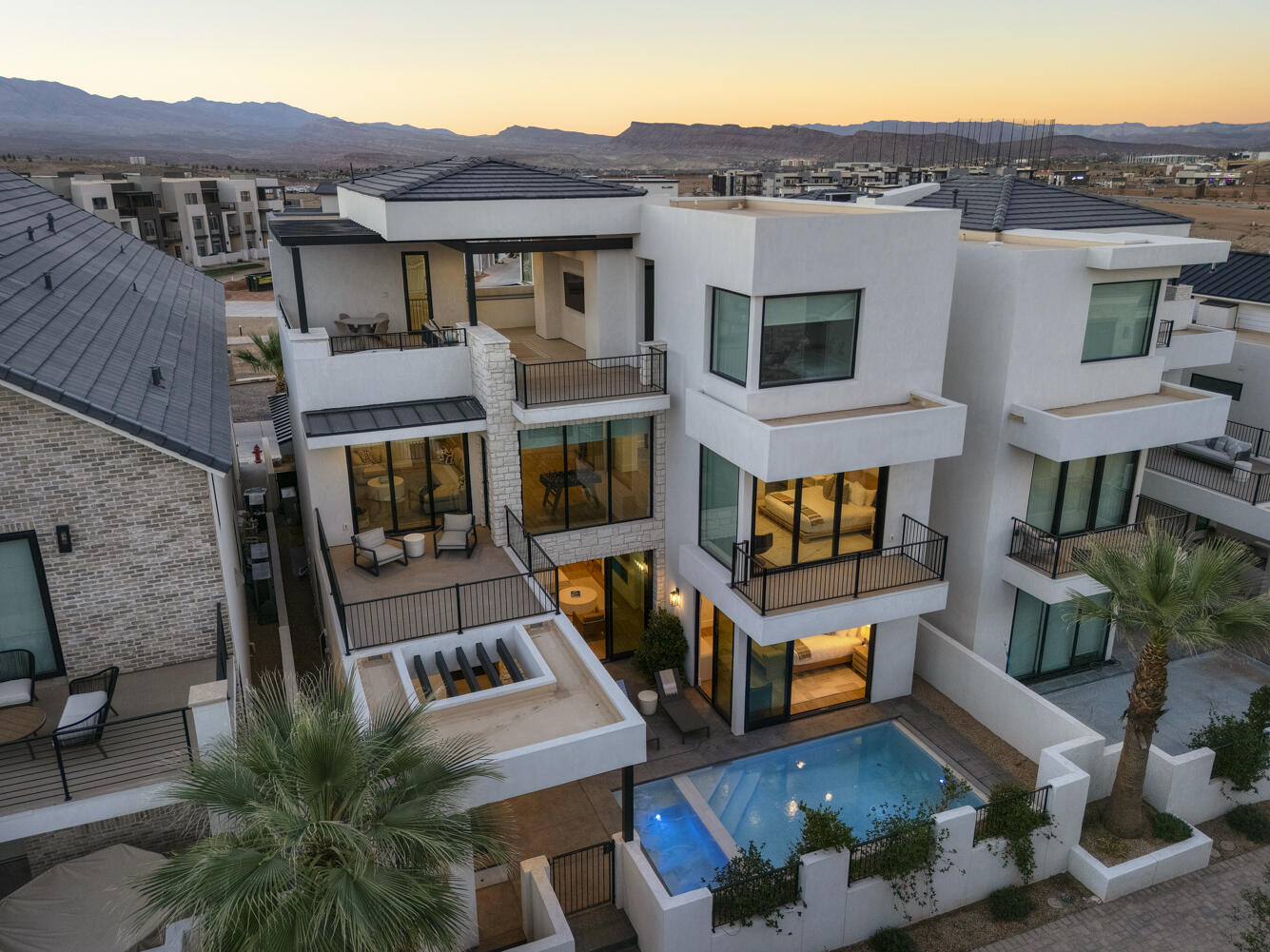 Elevated Luxury Living at this Desert Color Resort Oasis-Pura Sol! This stunning 3-story Split Rock home features 5 spacious bedrooms, effortlessly accommodating 18 guests in sheer comfort—no crowding! Enjoy your private patio with a pool, hot tub, outdoor bathroom and shower, barbeque, and ample seating for relaxation and entertainment. Expansive private decks and large picture windows throughout invite you to savor breathtaking views. A fully equipped fitness room, complete with a hydration station, caters to your wellness aspirations. Fully furnished and turn-key ready, this home is just steps from the lagoon, yet far enough to ensure peace and quiet. You will never want to leave this private sanctuary. Invest in this luxury retreat and profit. Don't miss your chance to own Pura Sol!