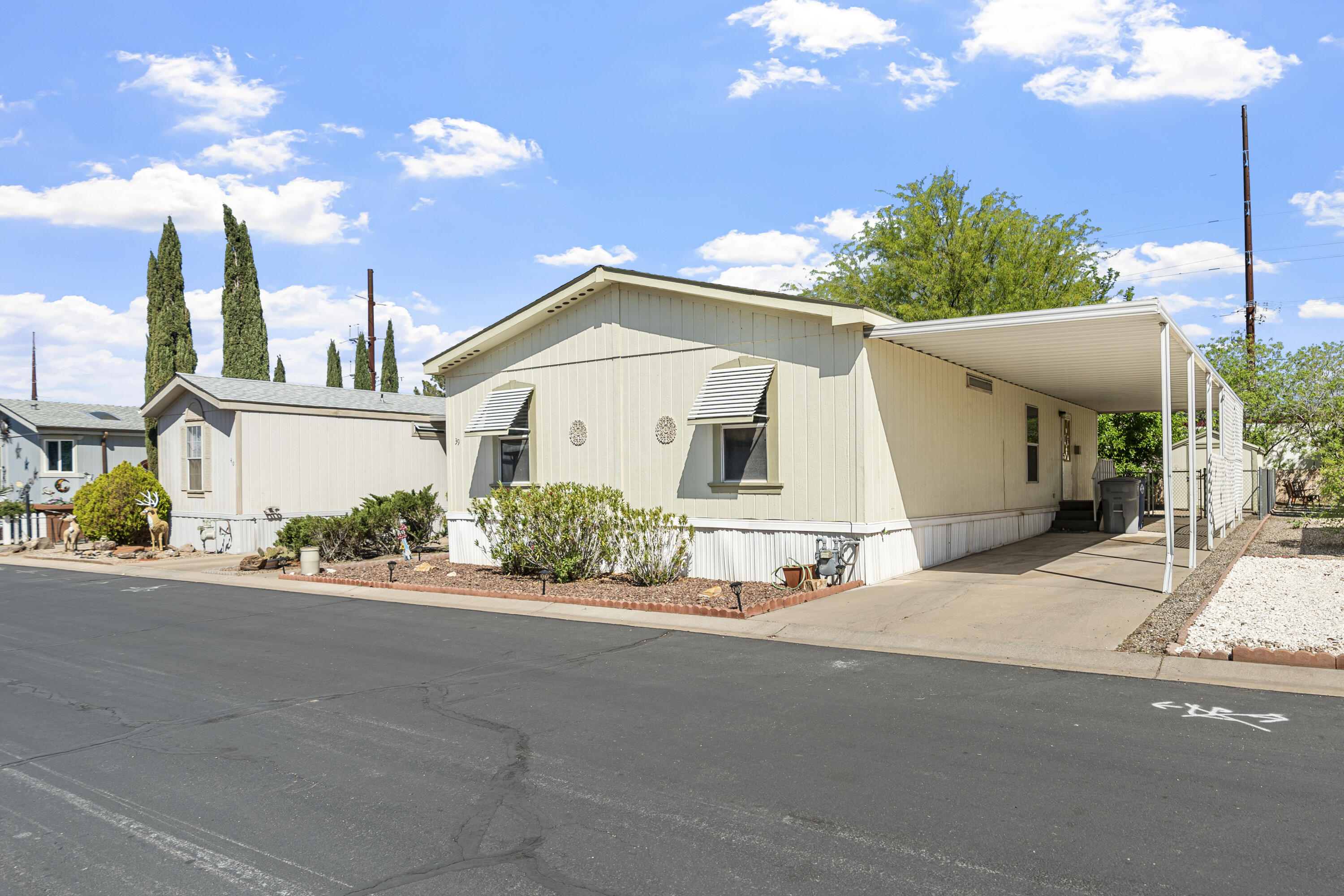 Charming 3 bed, 2 bath home in 55+ Paradise Palms community! This well-kept home features newer interior paint, newer flooring throughout, and a cozy kitchen full of charm. Enjoy the newer deck, spacious backyard, storage shed. Paradise Palms is a cooperative community where residents collectively own the land. The association fee covers land taxes, land payment, water, cable, common area maintenance. Buyers must complete their own due diligence and be approved by the HOA prior to closing. Check it out today--comfort and easy living await. Don't miss this one!