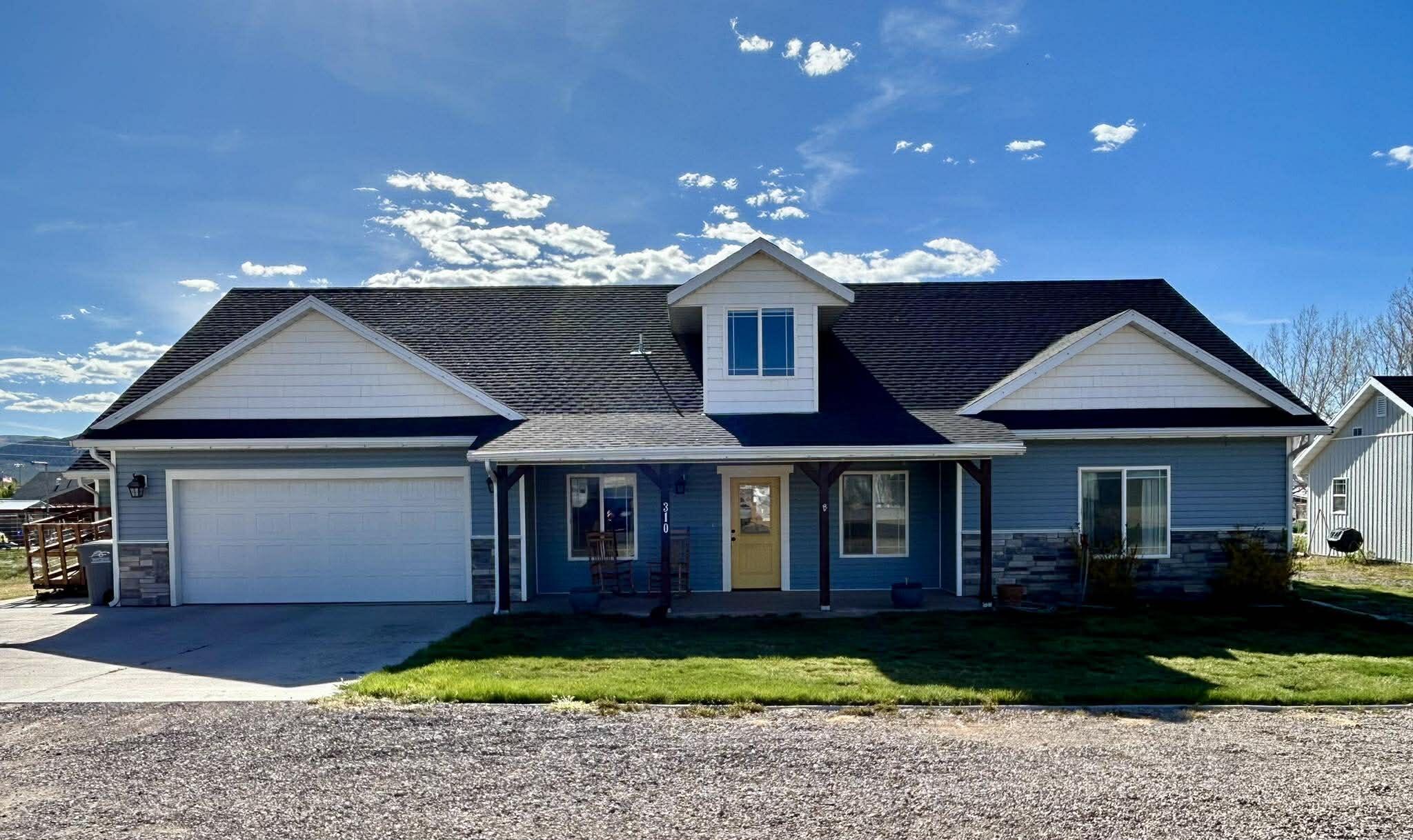Enjoy the perfect blend of space, comfort, and rural charm in this beautifully appointed 5-bedroom, 3-bath home situated on .43 acres of rural agricultural land. With 3,045 square feet of living space, this property offers room to grow, relax, and entertain.

Inside, you'll find large, spacious bedrooms designed for comfort, along with a versatile bonus room upstairs--perfect for a playroom, home office, or additional living area. The heart of the home features a welcoming family room with a cozy gas fireplace, creating the ideal space for gathering.

The kitchen is both stylish and functional, complete with granite countertops, stainless steel appliances, and a good-sized pantry--offering plenty of room for cooking and storage. The primary suite provides a peaceful retreat with a luxurious soaker tub and a large walk-in closet.

Upstairs, you'll also find a convenient storage closet with built in shelving near the bonus room, adding even more functionality to the home. Practicality continues with a large storage room located just off the mudroom and laundry area, making organization effortless.

Step outside to a backyard designed for both function and enjoyment, featuring a small shed, chicken coop, and dedicated garden area--perfect for embracing a rural lifestyle. A cement pad next to the garage provides additional parking for a third vehicle.

Additional highlights include a 2-car garage and a full automatic sprinkler system. With its generous lot size, quality finishes, and thoughtful layout, this property offers the perfect opportunity to enjoy rural living with modern comforts.
*(Rural agricultural zoning offers great flexibility, allowing for livestock, barns, and other agricultural uses. However, the specific number and type of animals permitted can vary, so it's important to verify current regulations with the local city office and zoning codes.)