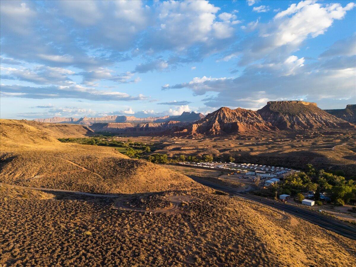 Incredible opportunity to own 9+ acres of Highway Resort Commercial land in Virgin, Utah.  

This is an amazing location with 360º views and right across the street from the new Autocamp Resort and adjacent to Zion Wildflower.

The town of Virgin is beaming with hospitality growth and this land development opportunity presents a blank canvas for your next investment vision.

Less than 15 minutes from Springdale and the South Entrance of Zion National Park. 30 minutes from the Hurricane Valley and only 45 minutes from the St George Regional Airport make access easy and convenient.