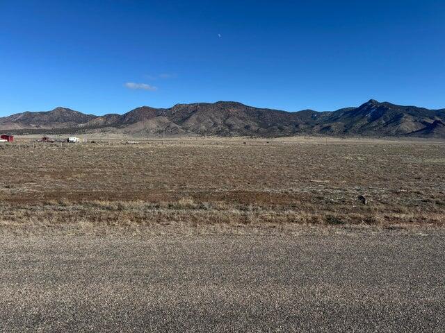 Fantastic 5ac lot available in the Broken Spur subdivision in Newcastle Utah. Right at the base of the Antelope Mountains. Paved road to the property for year round easy access. New water well installed in 2025. Pump will be installed before closing. Dixie Power line along East property line. Half acre foot of water right #71-5992 is included in the sale. Water right approved through a change application by the state in September 2025. Beautiful mountain and valley views. Build your dream home, 2nd home, or have a vacation retreat property to spend time w/ friends and family. Bring your RV, trailers, toys for getaways. Only 15 minutes to Newcastle Reservoir for boating and fishing. 50 Minutes to Cedar City or St. George. 20 min to Enterprise for Food/Amenities.