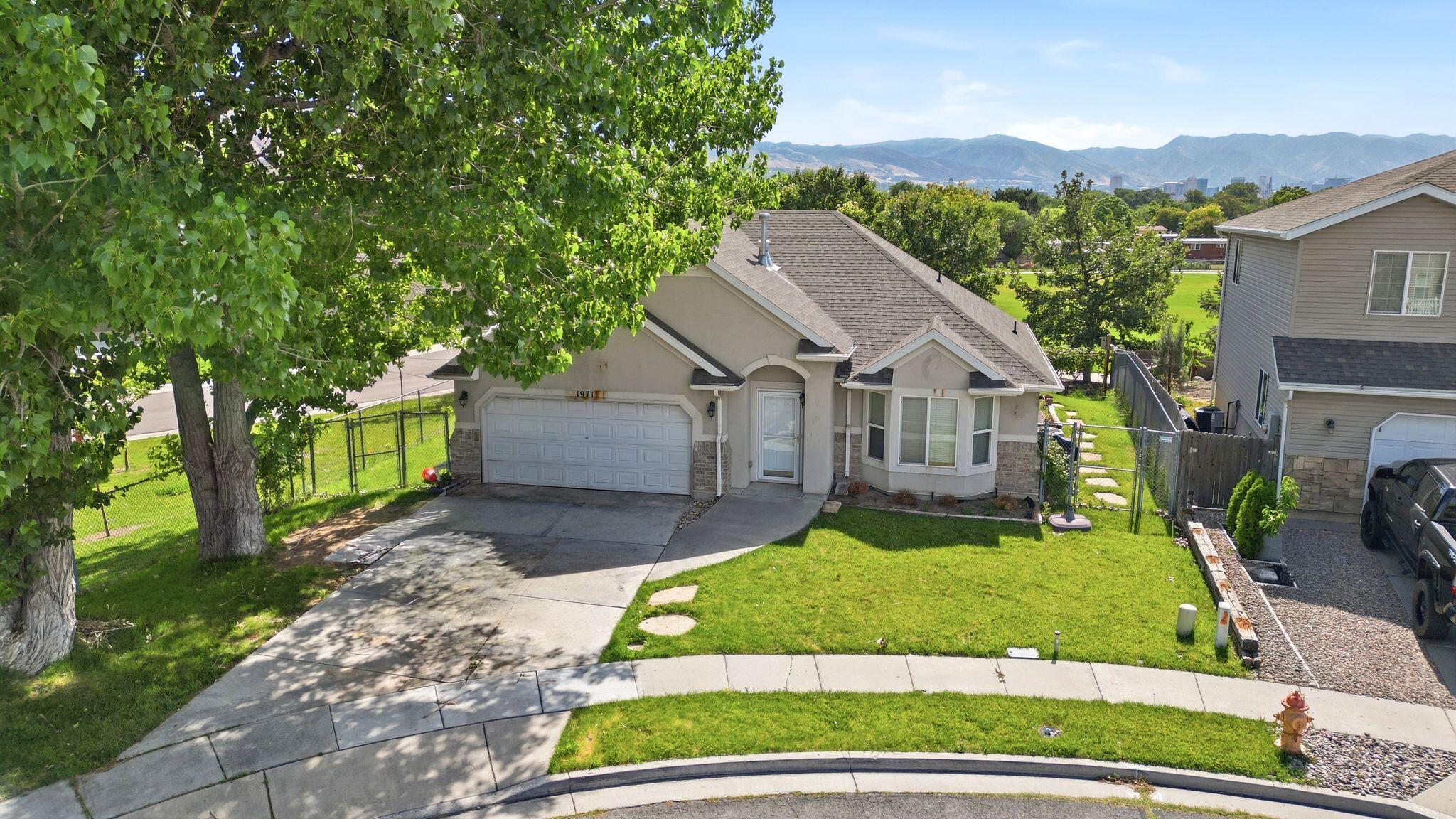 Tucked away in a quiet cul-de-sac, this beautifully maintained single-level home offers comfort, convenience, and an unbeatable location. Enjoy the ease of stair-free living with a functional floor plan and a spacious deck where you can relax while taking in panoramic city and mountain views. The elementary school is conveniently located next door, making daily routines a breeze. Commuters will appreciate the home's central location with quick access to all three major freeways and the airport, while shopping, dining, and everyday amenities are just minutes away. This is an exceptional opportunity to own a home that combines peaceful living with outstanding accessibility.
